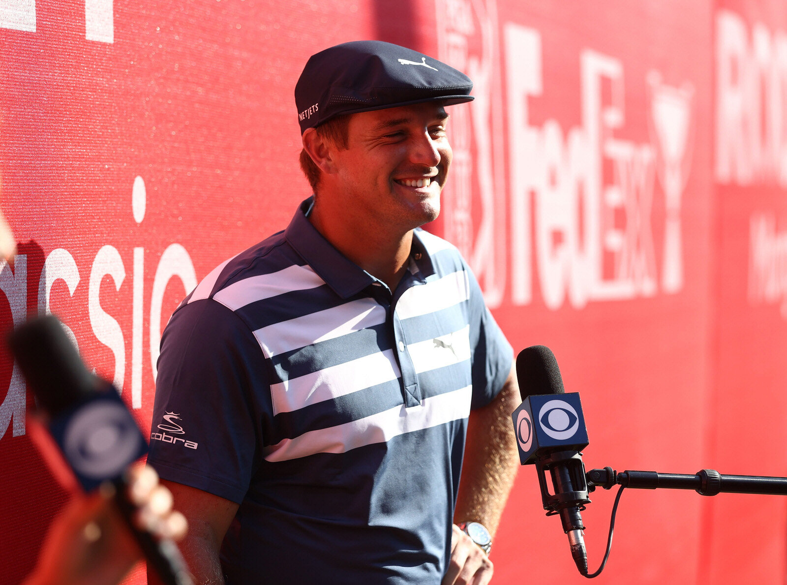  DETROIT, MICHIGAN - JULY 05: Bryson DeChambeau of the United States is interviewed after winning during the final round of the Rocket Mortgage Classic on July 05, 2020 at the Detroit Golf Club in Detroit, Michigan. (Photo by Gregory Shamus/Getty Ima