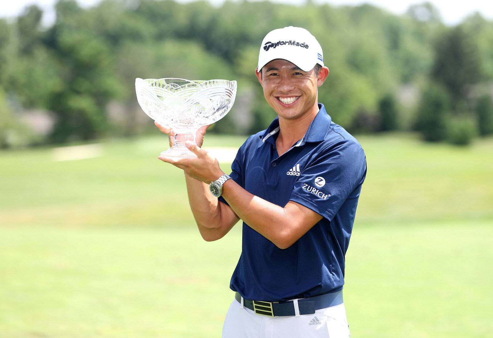  DUBLIN, OHIO - JULY 12: Collin Morikawa of the United States celebrates with the winner's trophy after the final round of the Workday Charity Open on July 12, 2020 at Muirfield Village Golf Club in Dublin, Ohio. (Photo by Gregory Shamus/Getty Images