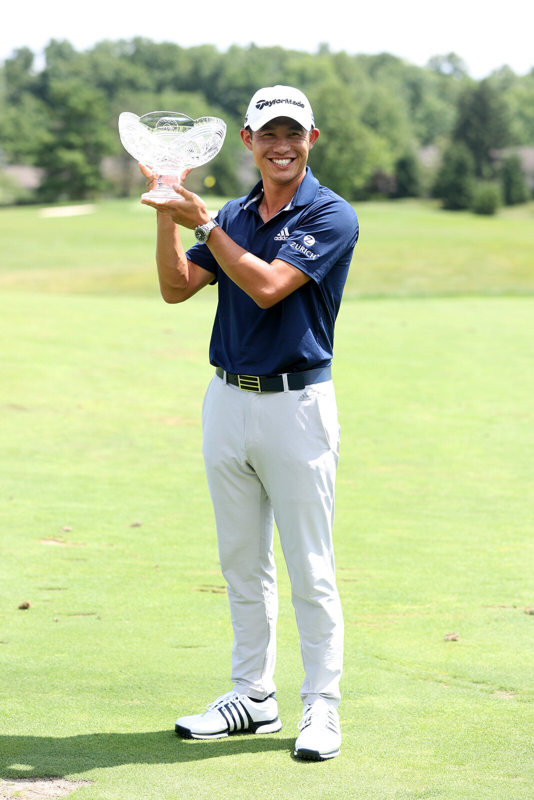  DUBLIN, OHIO - JULY 12: Collin Morikawa of the United States celebrates with the winner's trophy after the final round of the Workday Charity Open on July 12, 2020 at Muirfield Village Golf Club in Dublin, Ohio. (Photo by Gregory Shamus/Getty Images