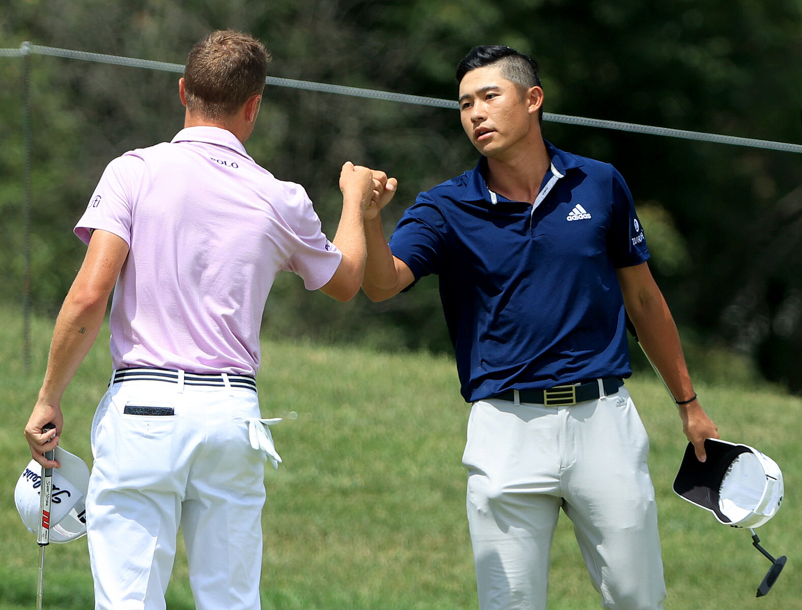  DUBLIN, OHIO - JULY 12: Collin Morikawa of the United States is congratulated by Justin Thomas of the United States after Morikawa 
defeated Thomas on the tenth green in the third playoff hole during the final round of the Workday Charity Open on Ju
