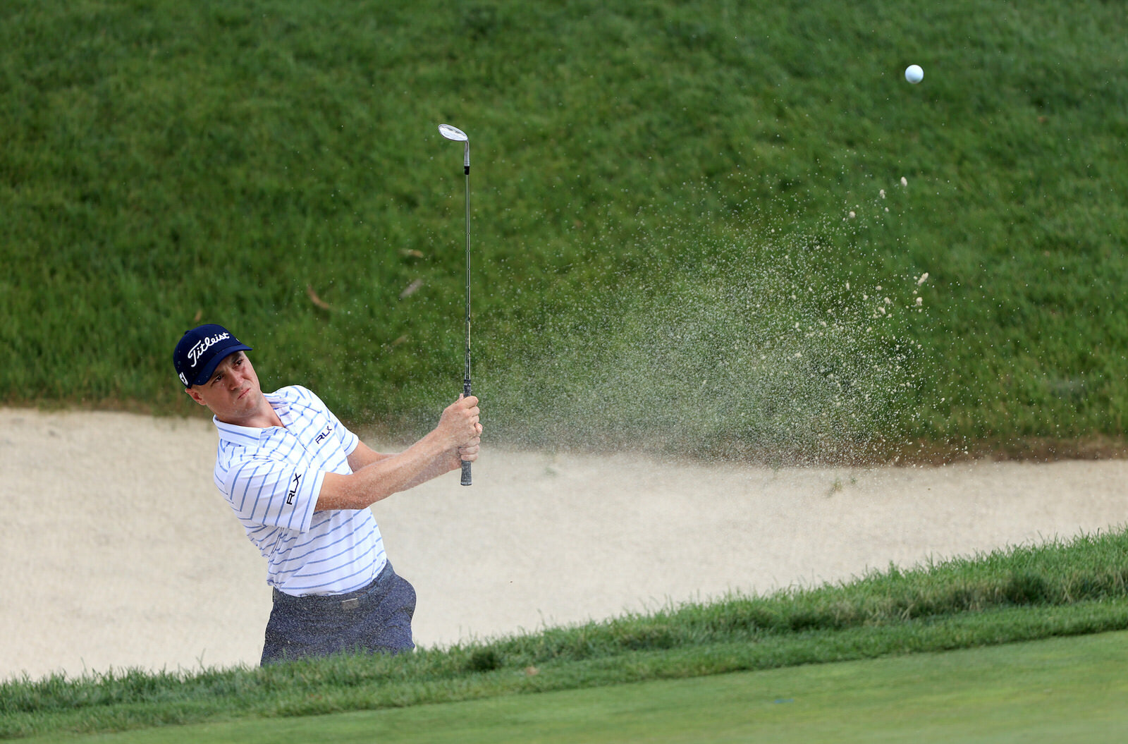  DUBLIN, OHIO - JULY 11: Justin Thomas of the United States plays a shot from a bunker on the 16th hole during the third round of the Workday Charity Open on July 11, 2020 at Muirfield Village Golf Club in Dublin, Ohio. (Photo by Sam Greenwood/Getty 