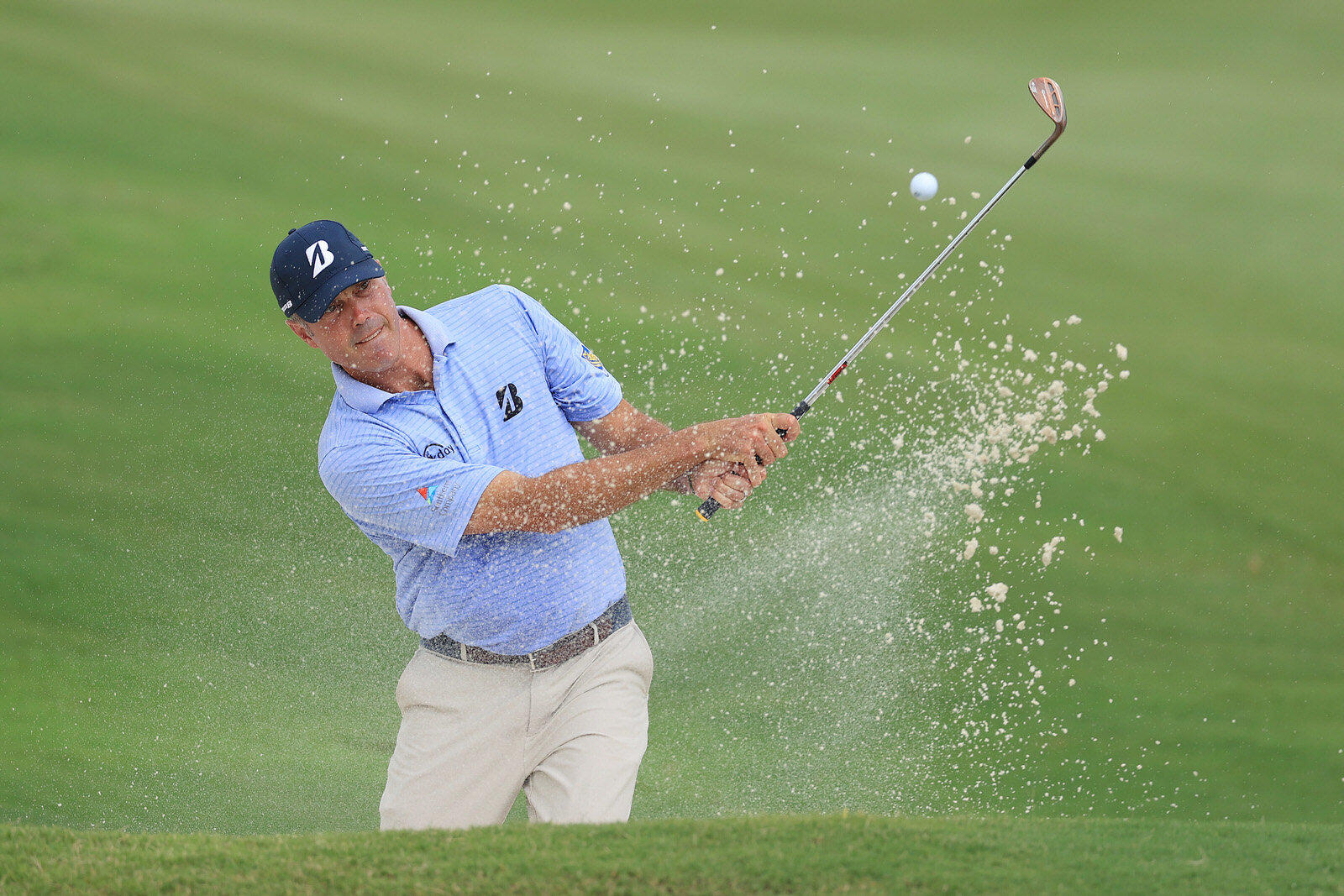  MEMPHIS, TENNESSEE - JULY 30: Matt Kuchar of the United States plays a shot from a bunker on the 16th hole during the first round of the World Golf Championship-FedEx St Jude Invitational at TPC Southwind on July 30, 2020 in Memphis, Tennessee. (Pho