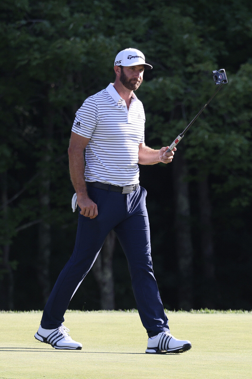  NORTON, MASSACHUSETTS - AUGUST 21: Dustin Johnson of the United States reacts after putting on the 18th hole to finish the day with a 60 during the second round of The Northern Trust at TPC Boston on August 21, 2020 in Norton, Massachusetts. (Photo 