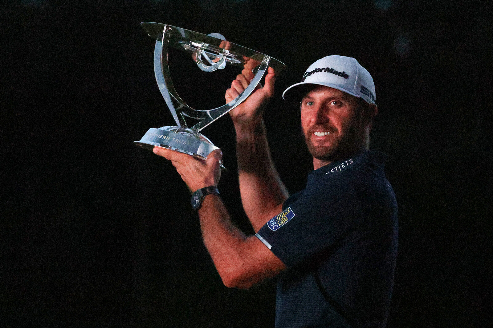  NORTON, MASSACHUSETTS - AUGUST 23: Dustin Johnson of the United States celebrates with the trophy after going 30-under par to win during the final round of The Northern Trust at TPC Boston on August 23, 2020 in Norton, Massachusetts. (Photo by Maddi