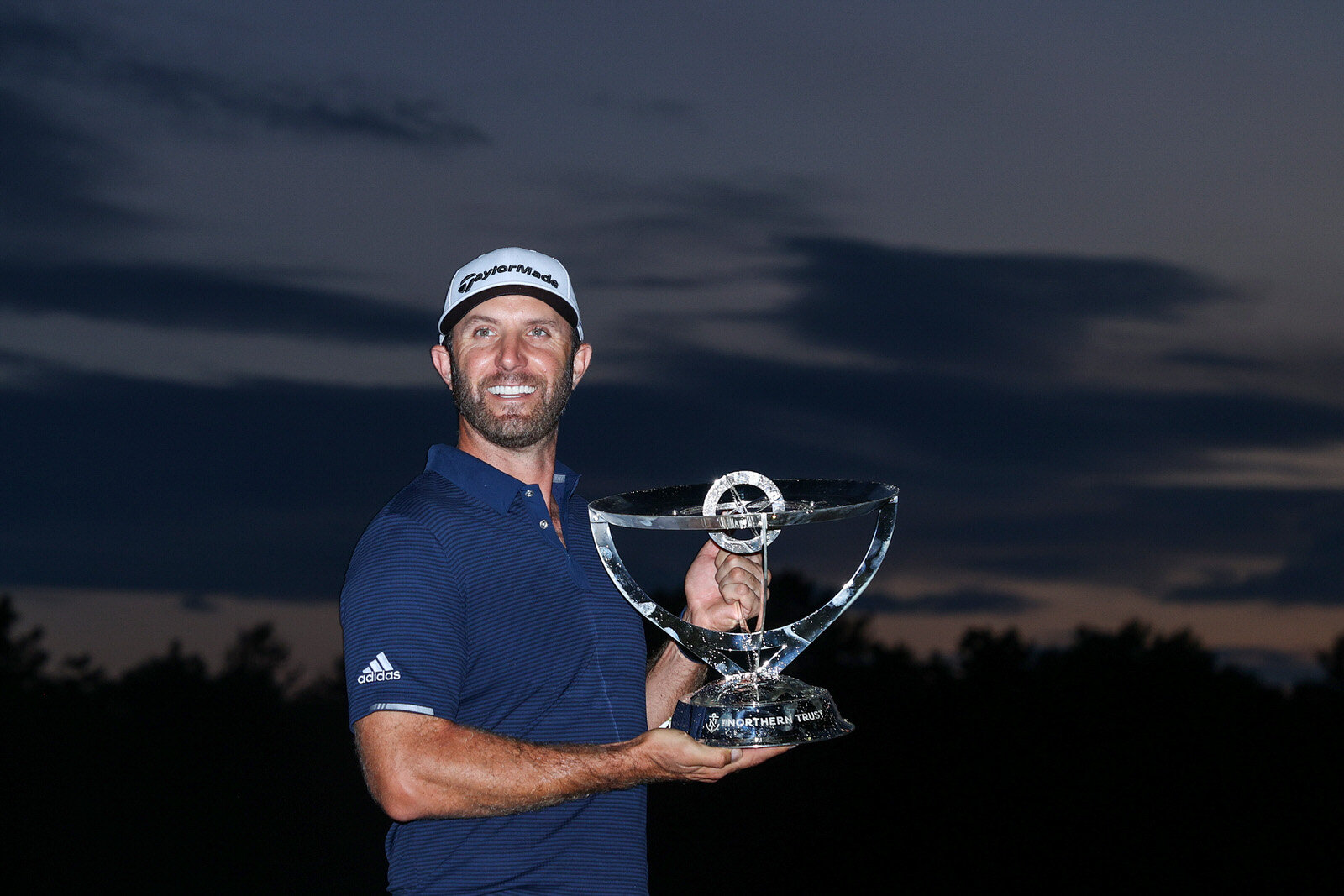  NORTON, MASSACHUSETTS - AUGUST 23: Dustin Johnson of the United States celebrates with the trophy after going 30-under par to win during the final round of The Northern Trust at TPC Boston on August 23, 2020 in Norton, Massachusetts. (Photo by Rob C