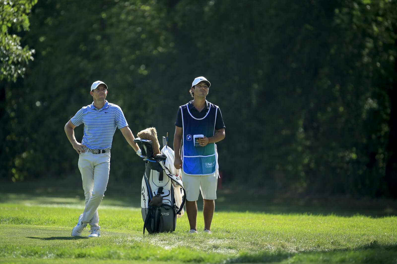  OLYMPIA FIELDS, ILLINOIS - AUGUST 28: Rory McIlroy of Northern Ireland and caddie Harry Diamond wait on the fifth fairway during the second round of the BMW Championship on the North Course at Olympia Fields Country Club on August 28, 2020 in Olympi