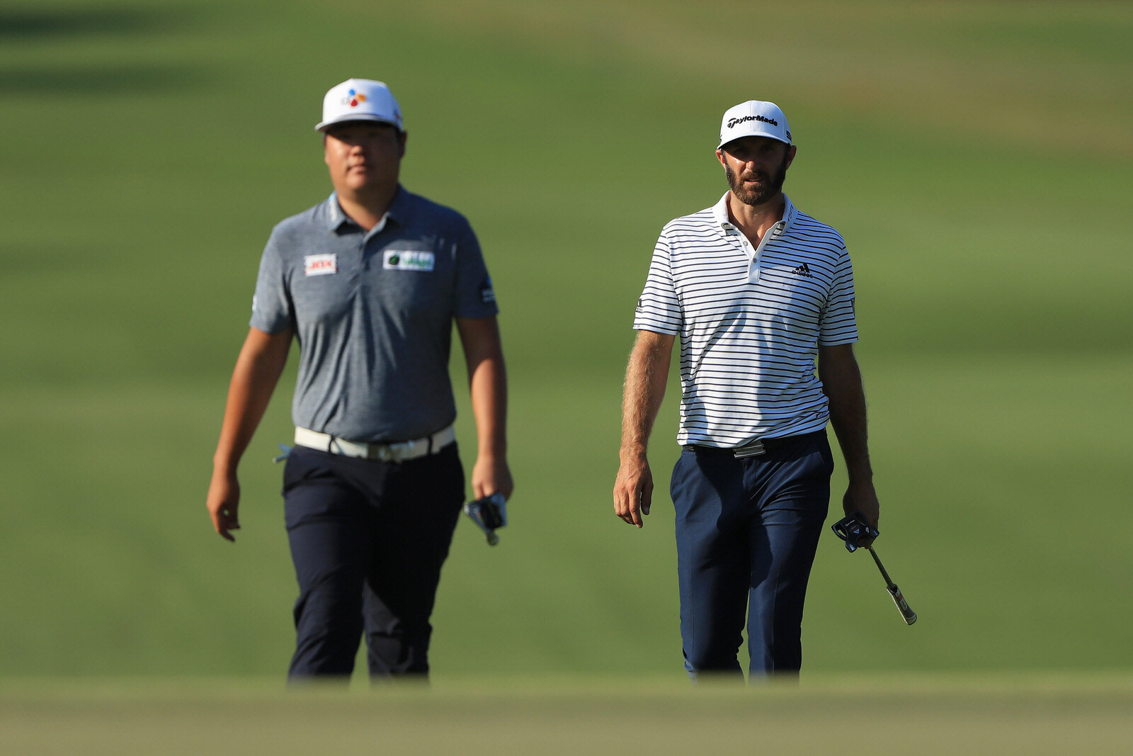  ATLANTA, GEORGIA - SEPTEMBER 06: Dustin Johnson of the United States and Sungjae Im of South Korea walk on the 14th hole during the third round of the TOUR Championship at East Lake Golf Club on September 06, 2020 in Atlanta, Georgia. (Photo by Sam 