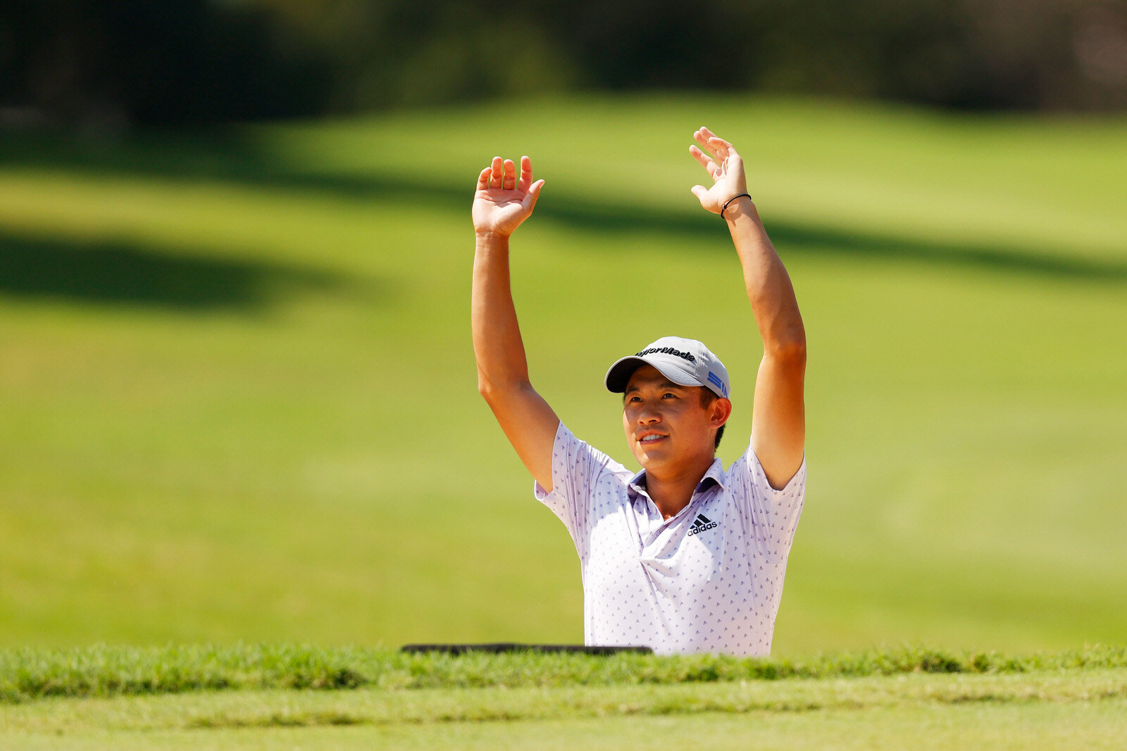 ATLANTA, GEORGIA - SEPTEMBER 06: Collin Morikawa of the United States reacts after holing out from a bunker on the first hole during the third round of the TOUR Championship at East Lake Golf Club on September 06, 2020 in Atlanta, Georgia. (Photo by
