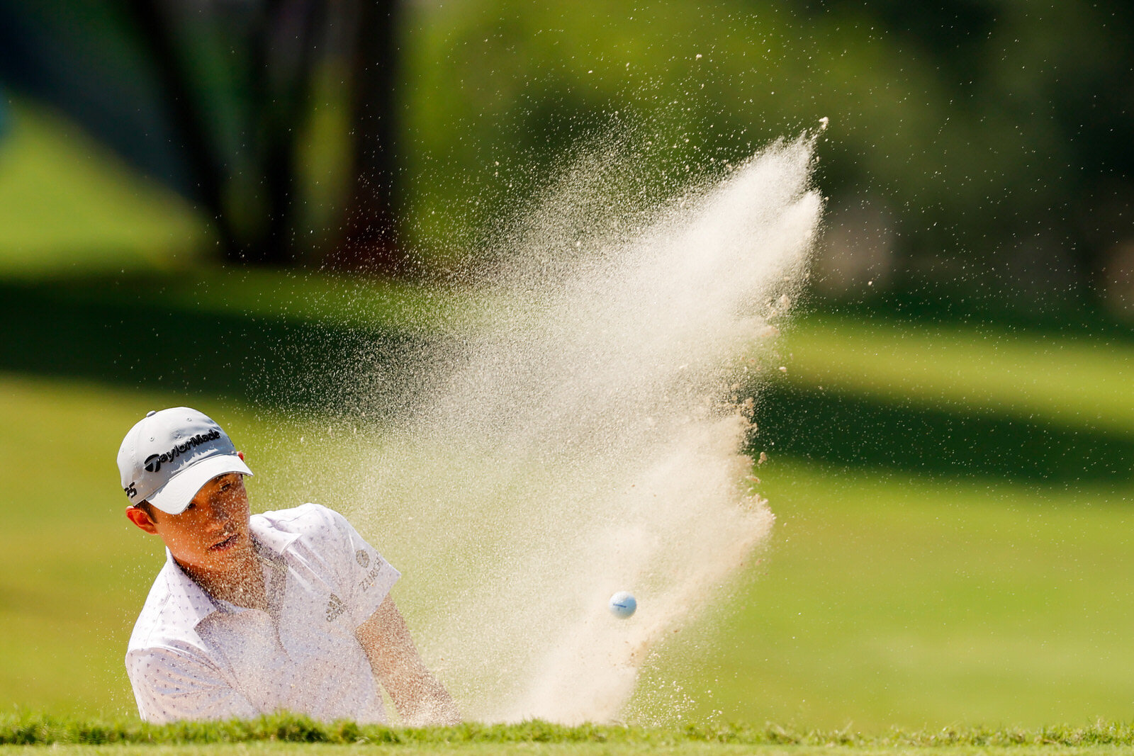  ATLANTA, GEORGIA - SEPTEMBER 06: Collin Morikawa of the United States holes out from a bunker on the first hole during the third round of the TOUR Championship at East Lake Golf Club on September 06, 2020 in Atlanta, Georgia. (Photo by Kevin C. Cox/