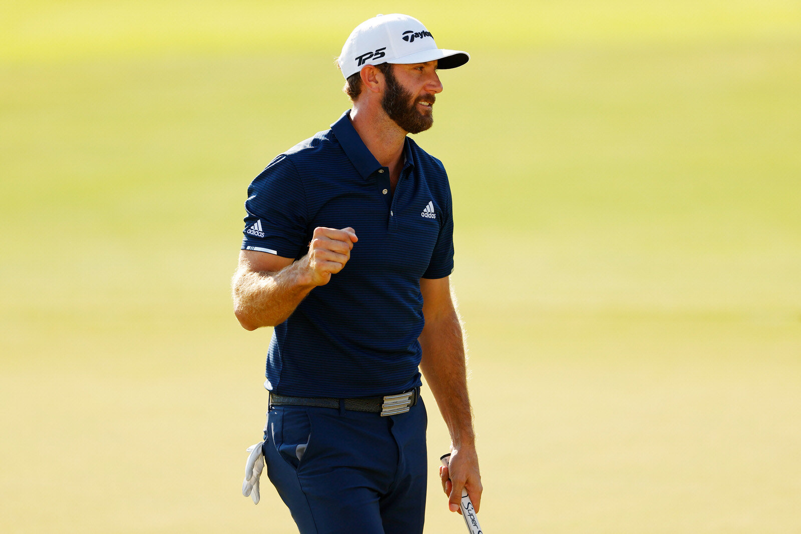  ATLANTA, GEORGIA - SEPTEMBER 07: Dustin Johnson of the United States celebrates on the 18th green after winning the FedEx Cup in the final round of the TOUR Championship at East Lake Golf Club on September 07, 2020 in Atlanta, Georgia. (Photo by Kev