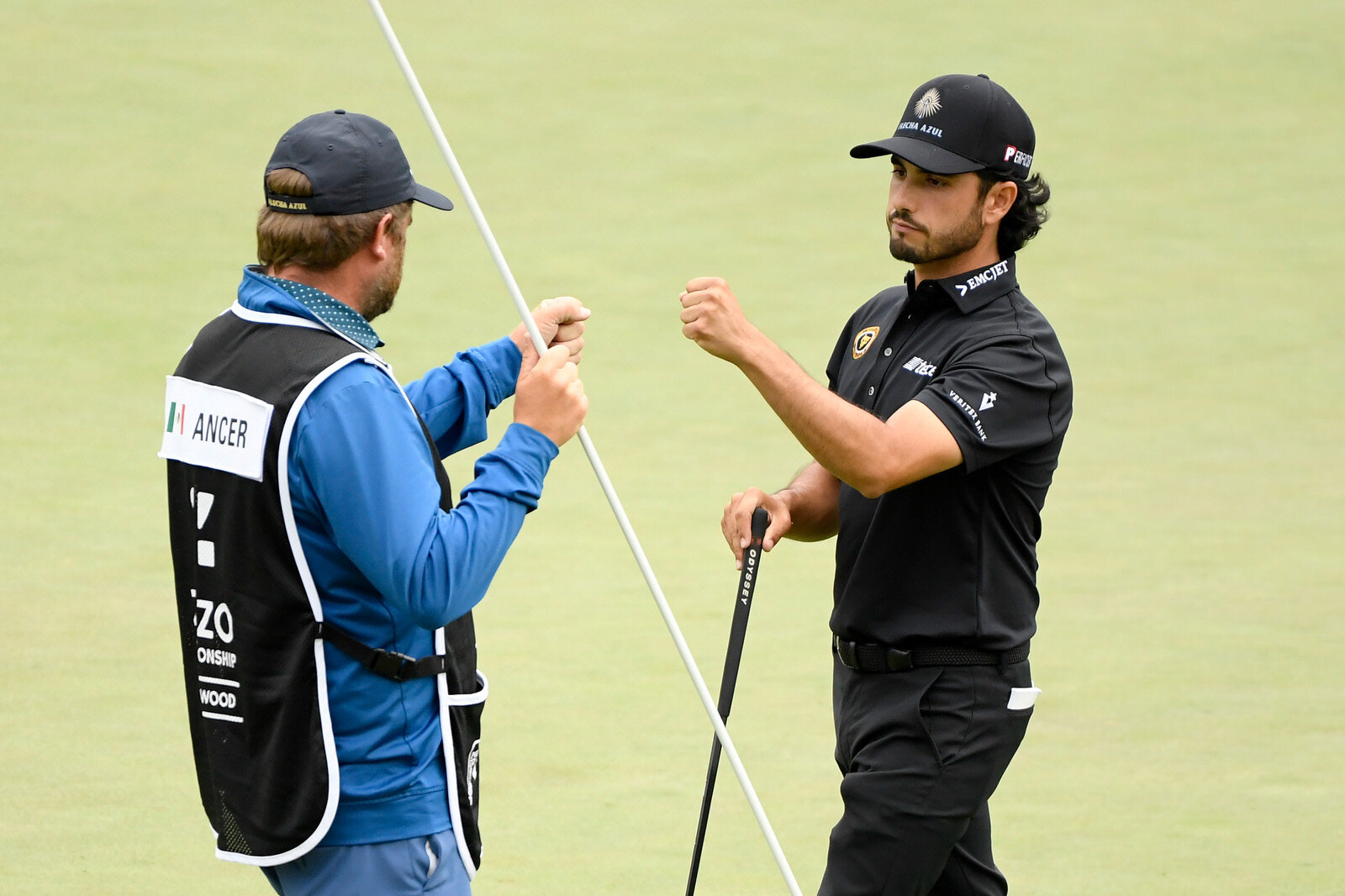  THOUSAND OAKS, CALIFORNIA - OCTOBER 23:  Abraham Ancer of Mexico bumps fists with his caddie after finishing on the 18th green during the second round of the Zozo Championship @ Sherwood on October 23, 2020 in Thousand Oaks, California. (Photo by Ha