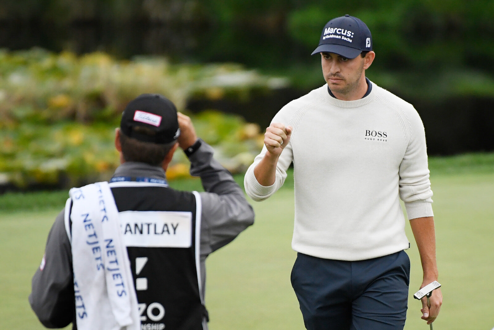  THOUSAND OAKS, CALIFORNIA - OCTOBER 25: Patrick Cantlay of the United States celebrates with his caddie Matt Minister after finishing on the 18th green during the final round of the Zozo Championship @ Sherwood on October 25, 2020 in Thousand Oaks, 