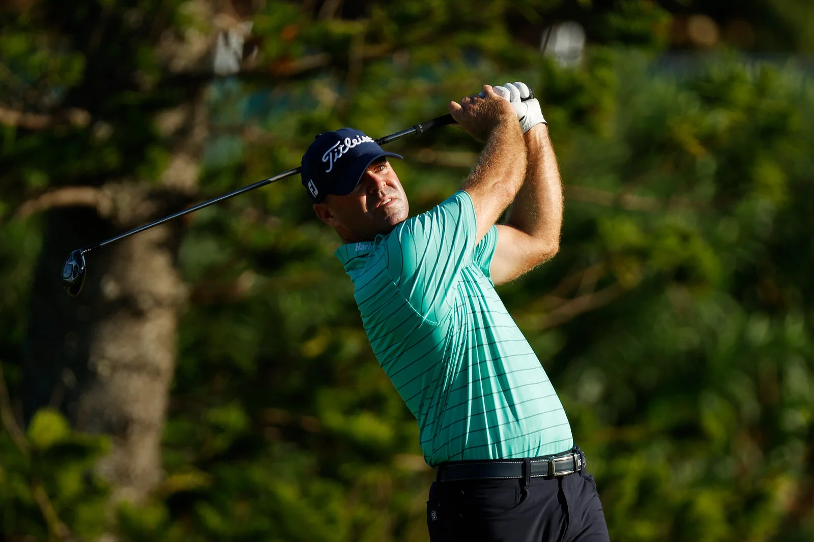 Harrington scrambles well in Bermuda winds