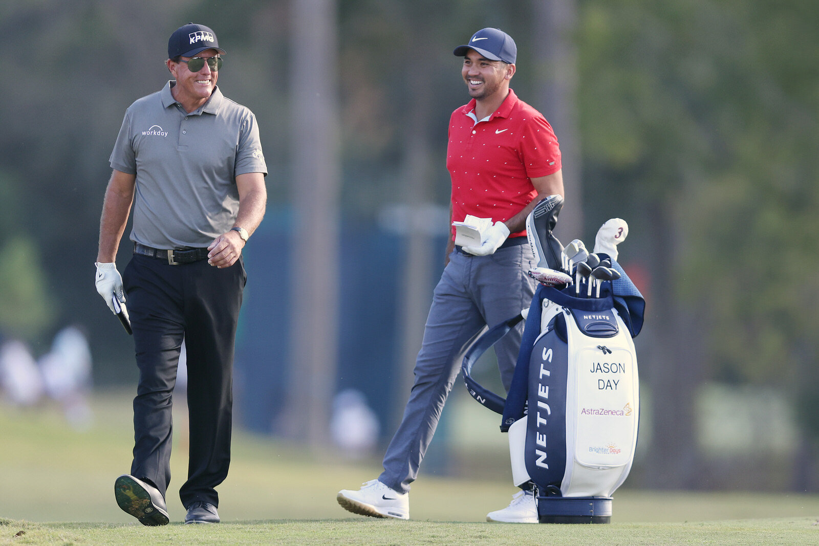  HOUSTON, TEXAS - NOVEMBER 05: Phil Mickelson of the United States and Jason Day of Australia laugh on the third hole during the first round of the Vivint Houston Open at Memorial Park Golf Course on November 05, 2020 in Houston, Texas. (Photo by Car