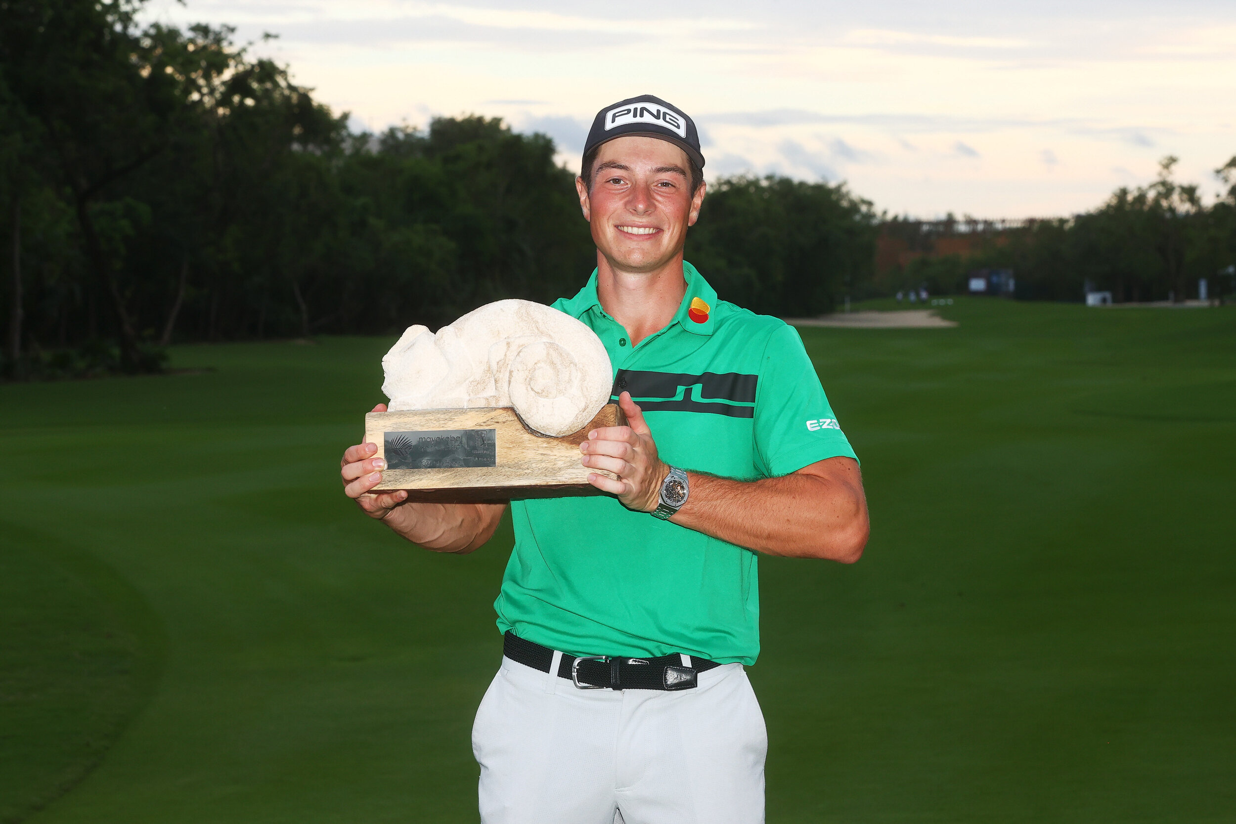 PLAYA DEL CARMEN, MEXICO - DECEMBER 06: Viktor Hovland of Norway celebrates with the winner's trophy on the 18th green after the final round of the Mayakoba Golf Classic at El Camaleón Golf Club on December 06, 2020 in Playa del Carmen, Mexico. (Pho