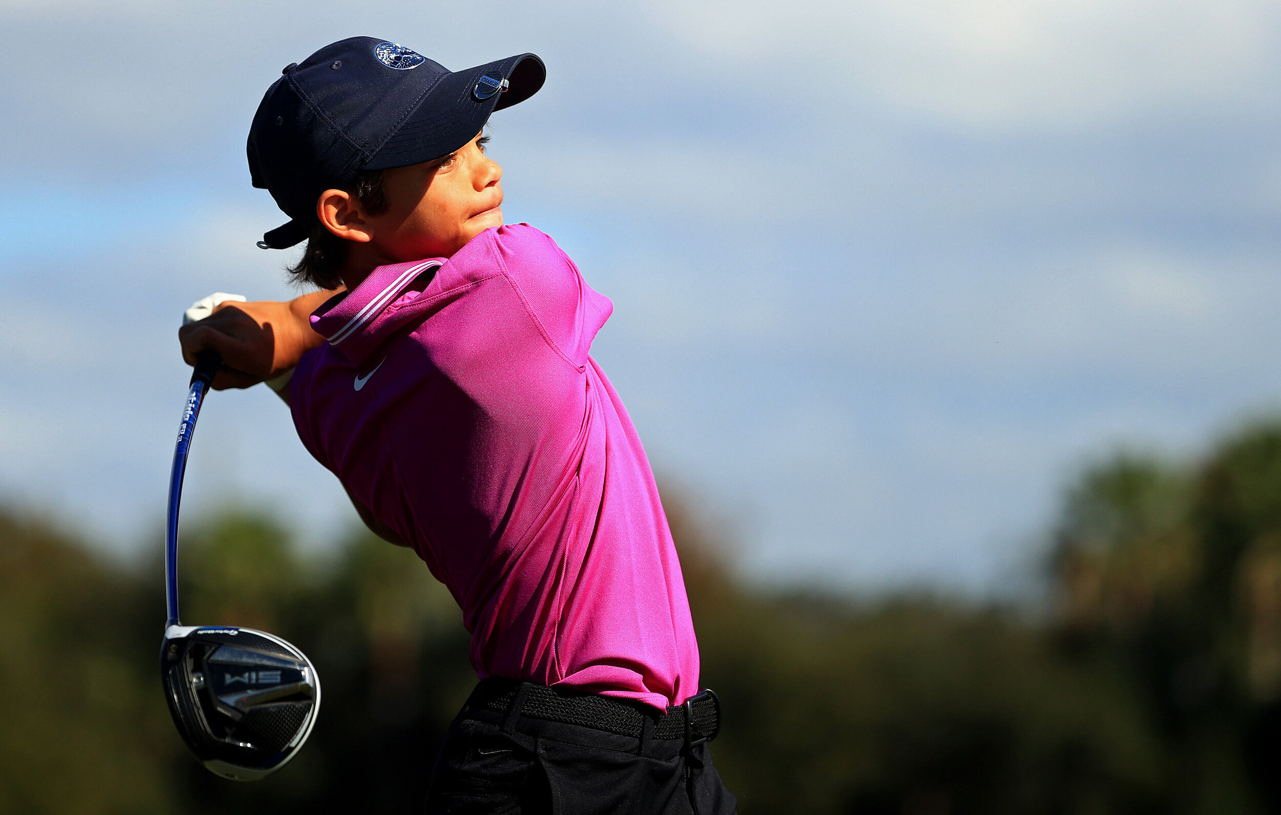  ORLANDO, FLORIDA - DECEMBER 19: Tiger Woods of the United States son Charlie Woods hits his tee shot on the ninth hole during the first round of the PNC Championship at the Ritz Carlton Golf Club on December 19, 2020 in Orlando, Florida. (Photo by M