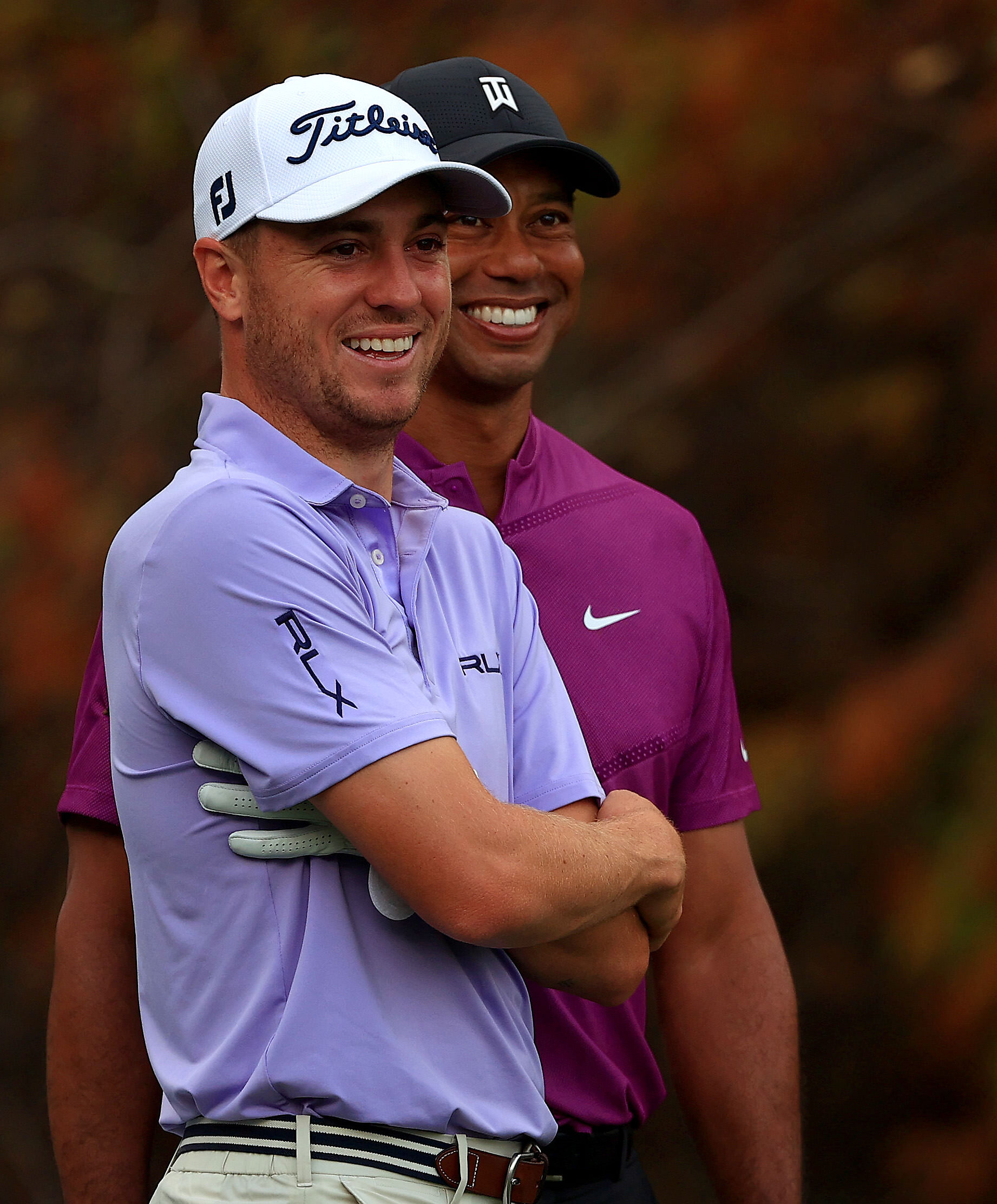  ORLANDO, FLORIDA - DECEMBER 19: Tiger Woods of the United States and  Justin Thomas of the United States laugh on the 18th hole during the first round of the PNC Championship at the Ritz Carlton Golf Club on December 19, 2020 in Orlando, Florida. (P