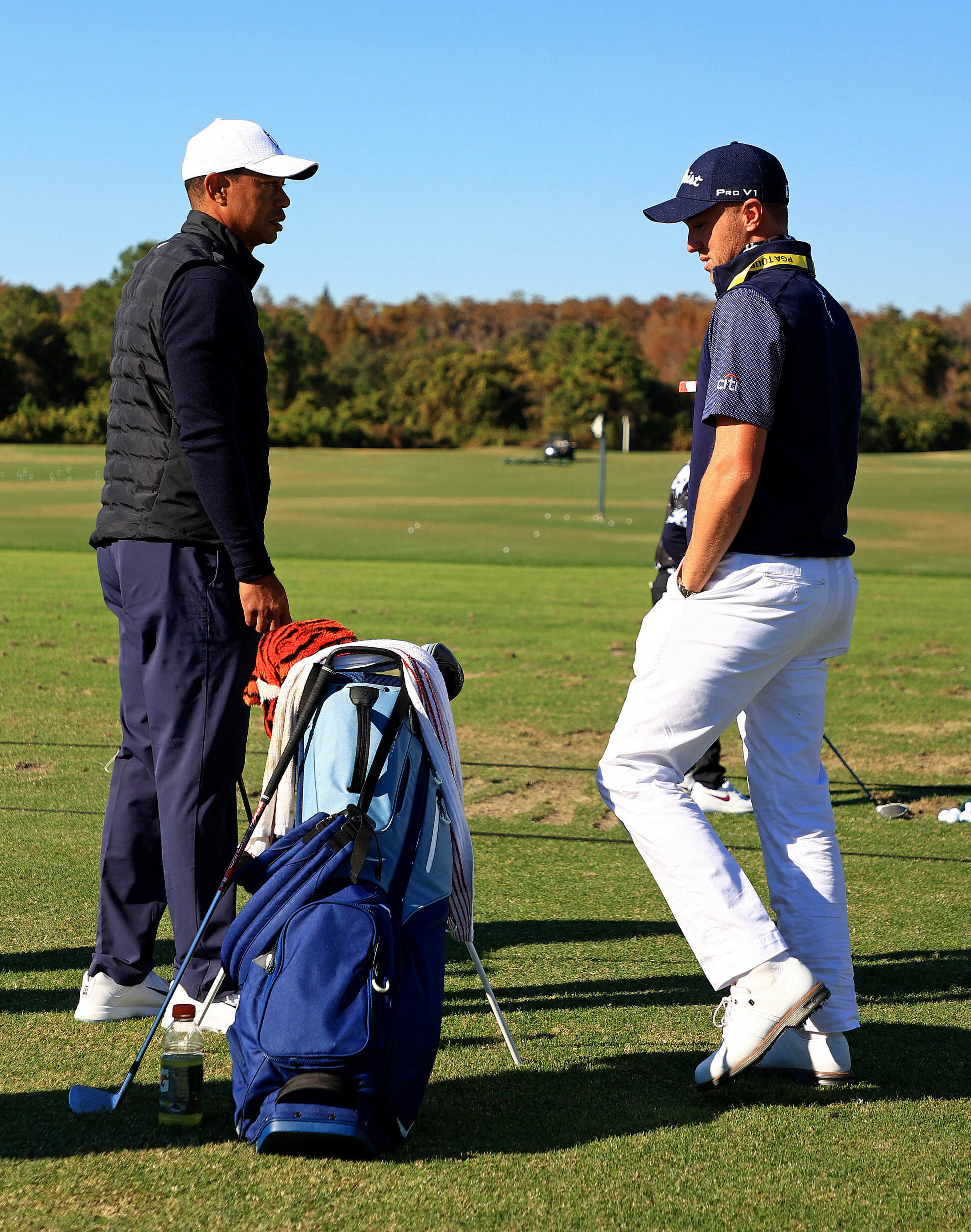  ORLANDO, FLORIDA - DECEMBER 18: Tiger Woods of the United States and  Justin Thomas of the United States talk during the Pro-Am for the PNC Championship at the Ritz Carlton Golf Club on December 18, 2020 in Orlando, Florida. (Photo by Mike Ehrmann/G