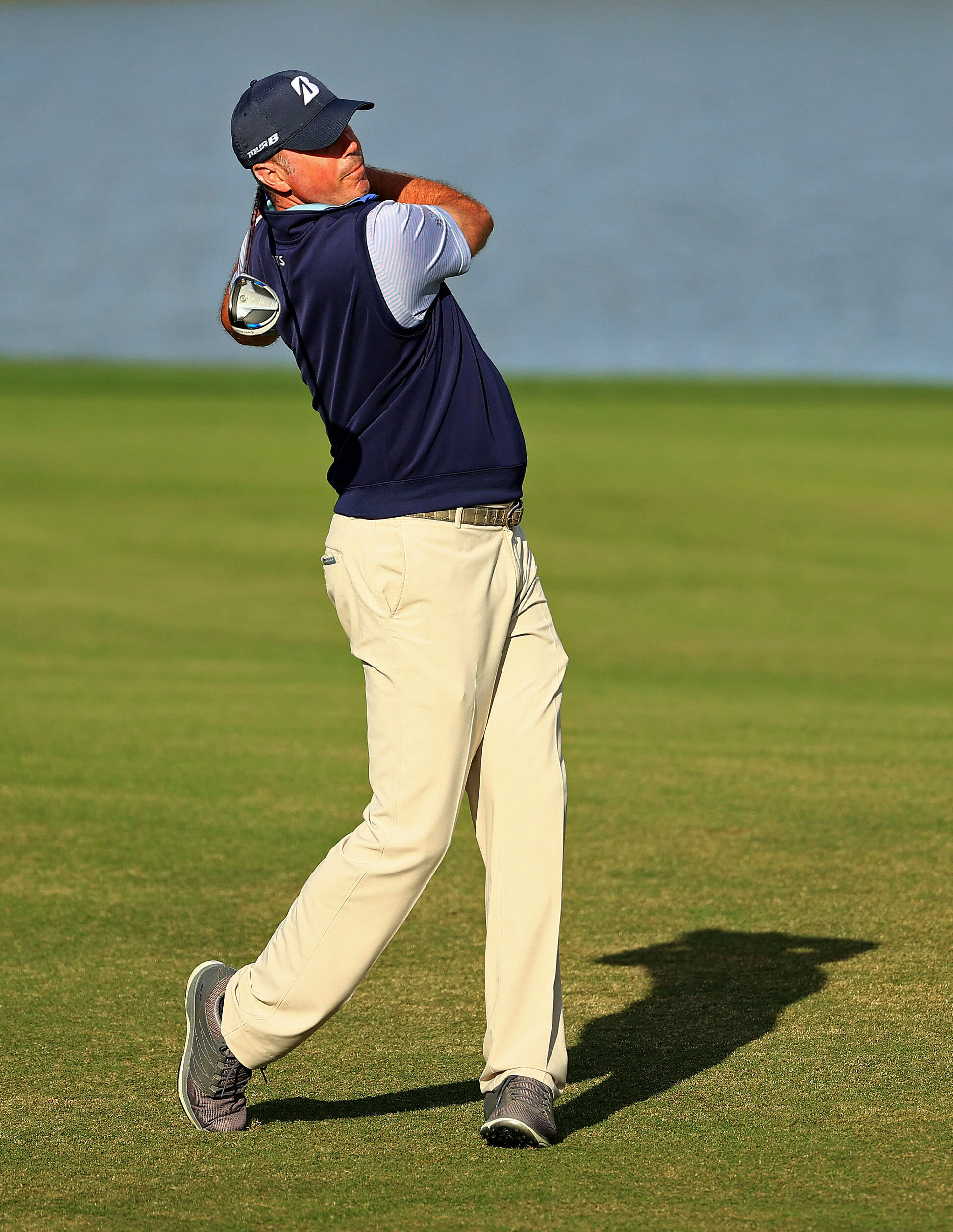  ORLANDO, FLORIDA - DECEMBER 19:  Matt Kuchar of the United States hits his approach shot on the 18th hole during the first round of the PNC Championship at the Ritz Carlton Golf Club on December 19, 2020 in Orlando, Florida. (Photo by Mike Ehrmann/G