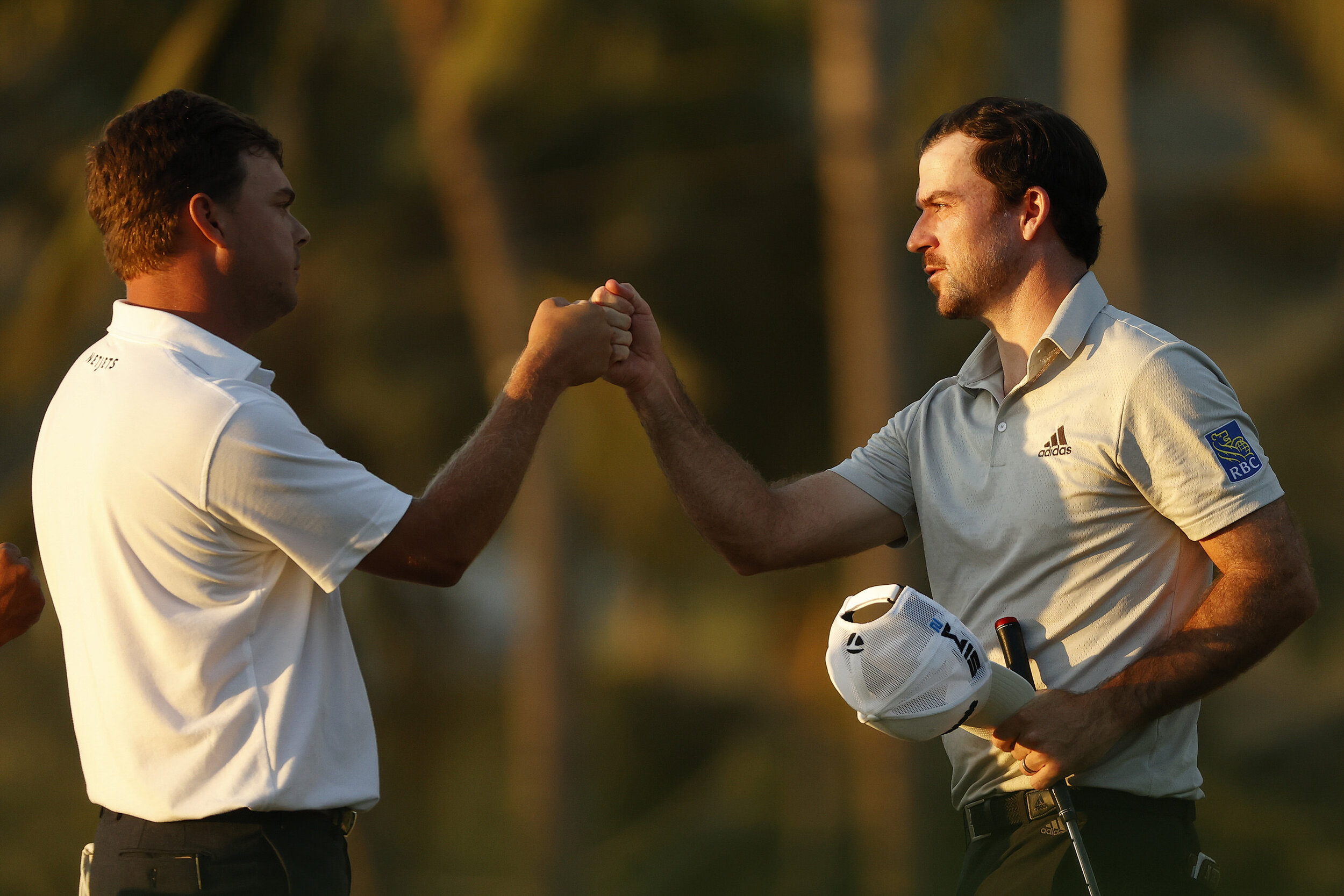  HONOLULU, HAWAII - JANUARY 15: (L-R) Keith Mitchell of the United States and Nick Taylor of Canada fist bump after finishing on the ninth hole during the second round of the Sony Open in Hawaii at the Waialae Country Club on January 15, 2021 in Hono