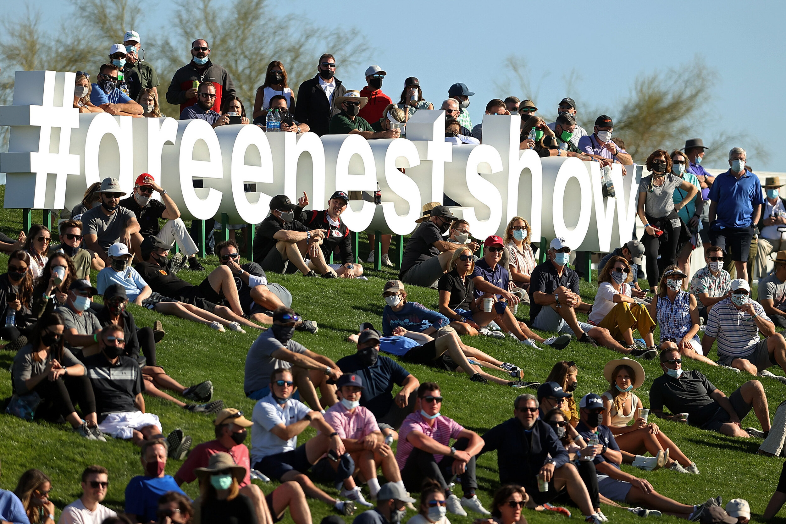  SCOTTSDALE, ARIZONA - FEBRUARY 06: Fans watch action during the third round of the Waste Management Phoenix Open at TPC Scottsdale on February 06, 2021 in Scottsdale, Arizona. In what is normally considered "The People's Open", crowds were drastical