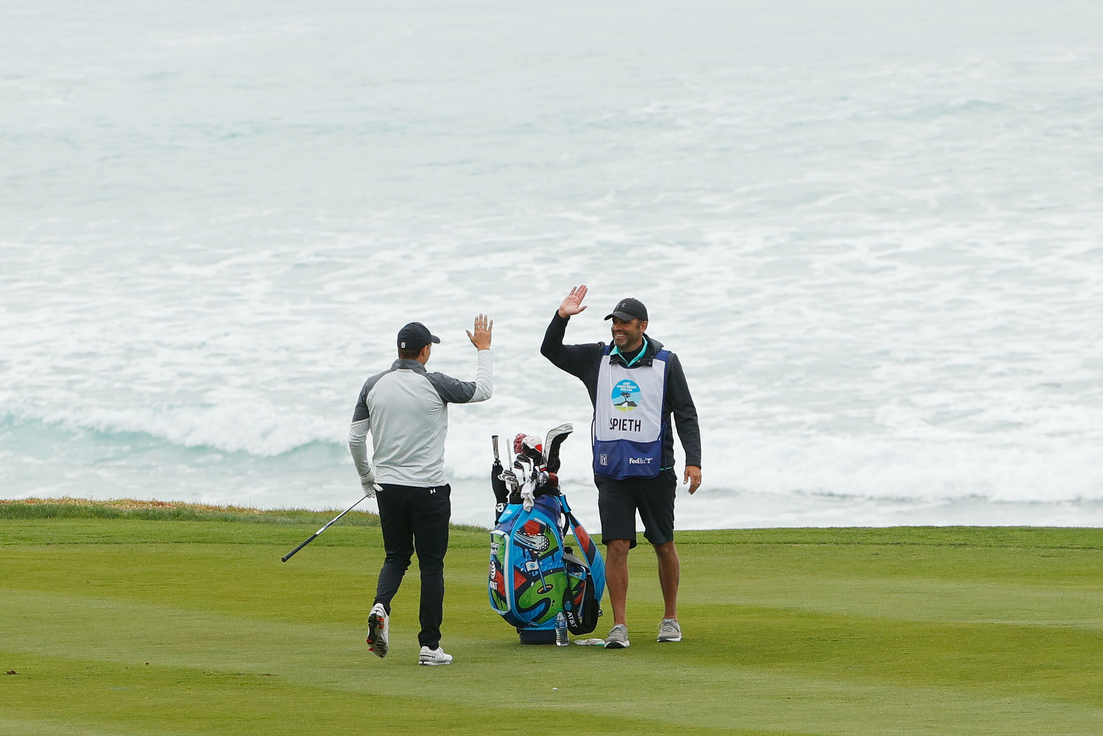  PEBBLE BEACH, CALIFORNIA - FEBRUARY 11: Jordan Spieth of the United States and caddie Michael Greller celebrate his eagle on the tenth hole during the first round of the AT&T Pebble Beach Pro-Am at Pebble Beach Golf Links on February 11, 2021 in Peb