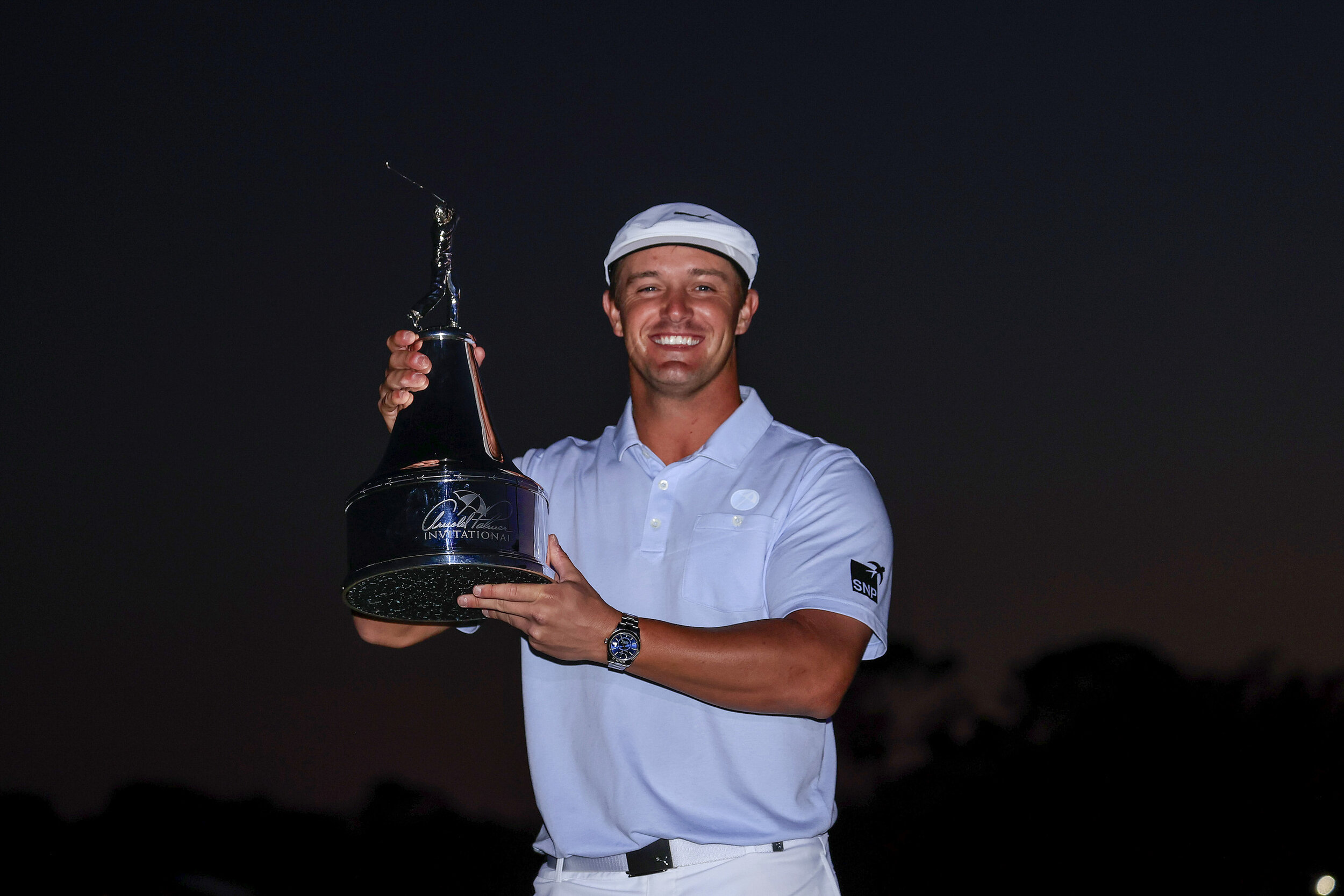  ORLANDO, FLORIDA - MARCH 07: Bryson DeChambeau of the United States celebrates with the trophy after winning the final round of the Arnold Palmer Invitational Presented by MasterCard at the Bay Hill Club and Lodge on March 07, 2021 in Orlando, Flori