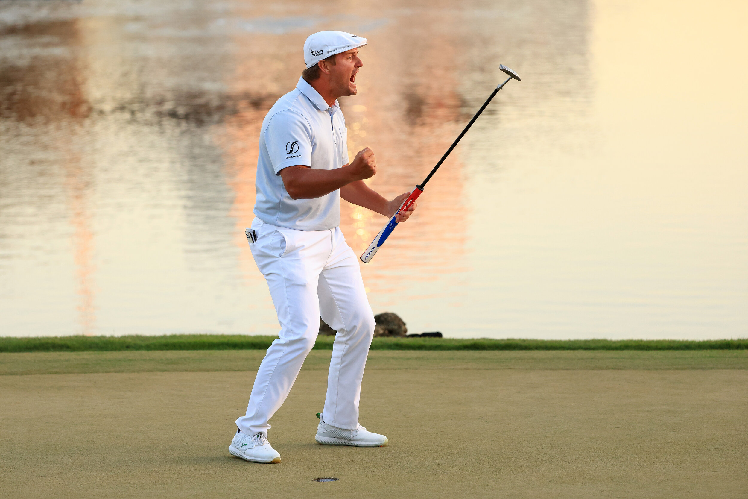  ORLANDO, FLORIDA - MARCH 07: Bryson DeChambeau of the United States celebrates making his putt on the 18th green to win during the final round of the Arnold Palmer Invitational Presented by MasterCard at the Bay Hill Club and Lodge on March 07, 2021
