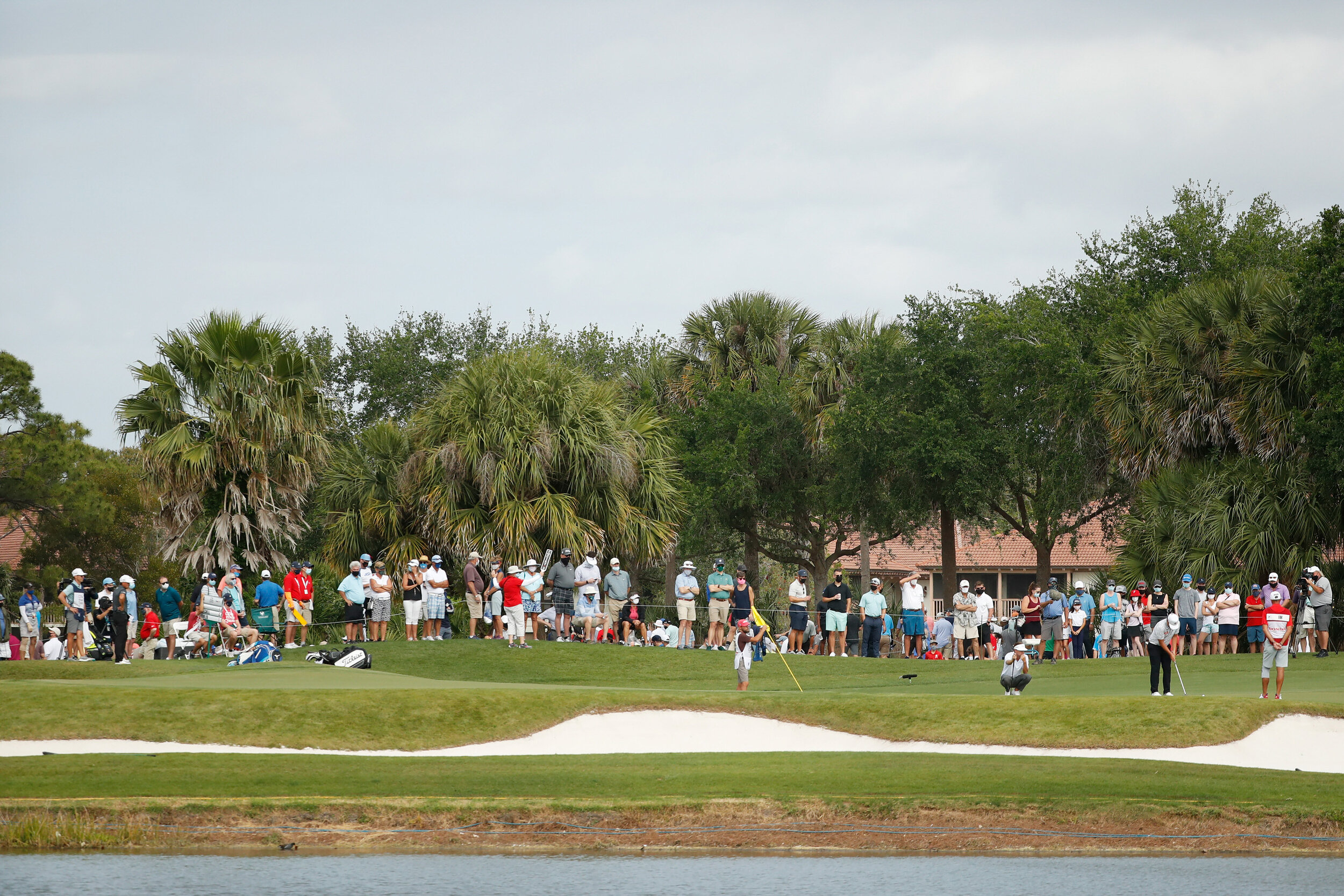  PALM BEACH GARDENS, FLORIDA - MARCH 19: A general view of the first green as fans follow the group of Rickie Fowler of the United States, Sungjae Im of South Korea and Keith Mitchell of the United States during the second round of The Honda Classic 