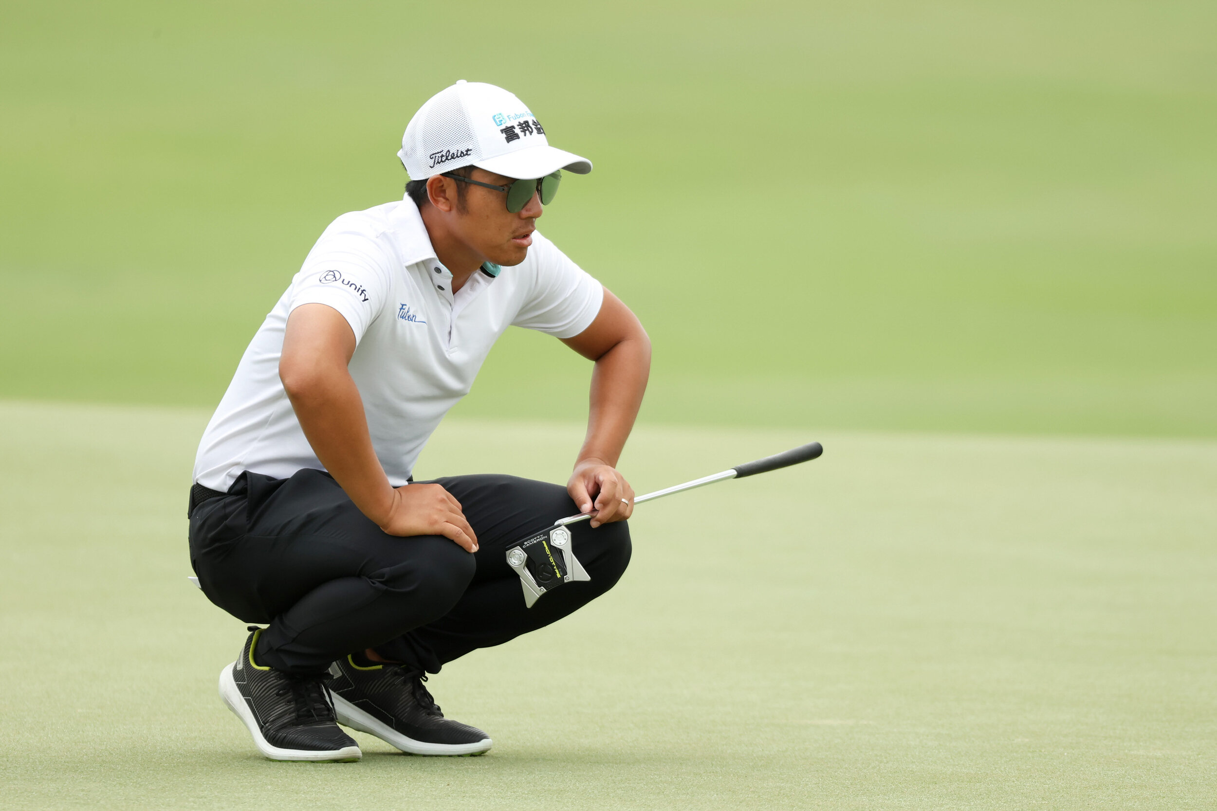  PALM BEACH GARDENS, FLORIDA - MARCH 20: C.T. Pan of Taiwan lines up a putt on the ninth green during the third round of The Honda Classic at PGA National Champion course on March 20, 2021 in Palm Beach Gardens, Florida. (Photo by Cliff Hawkins/Getty