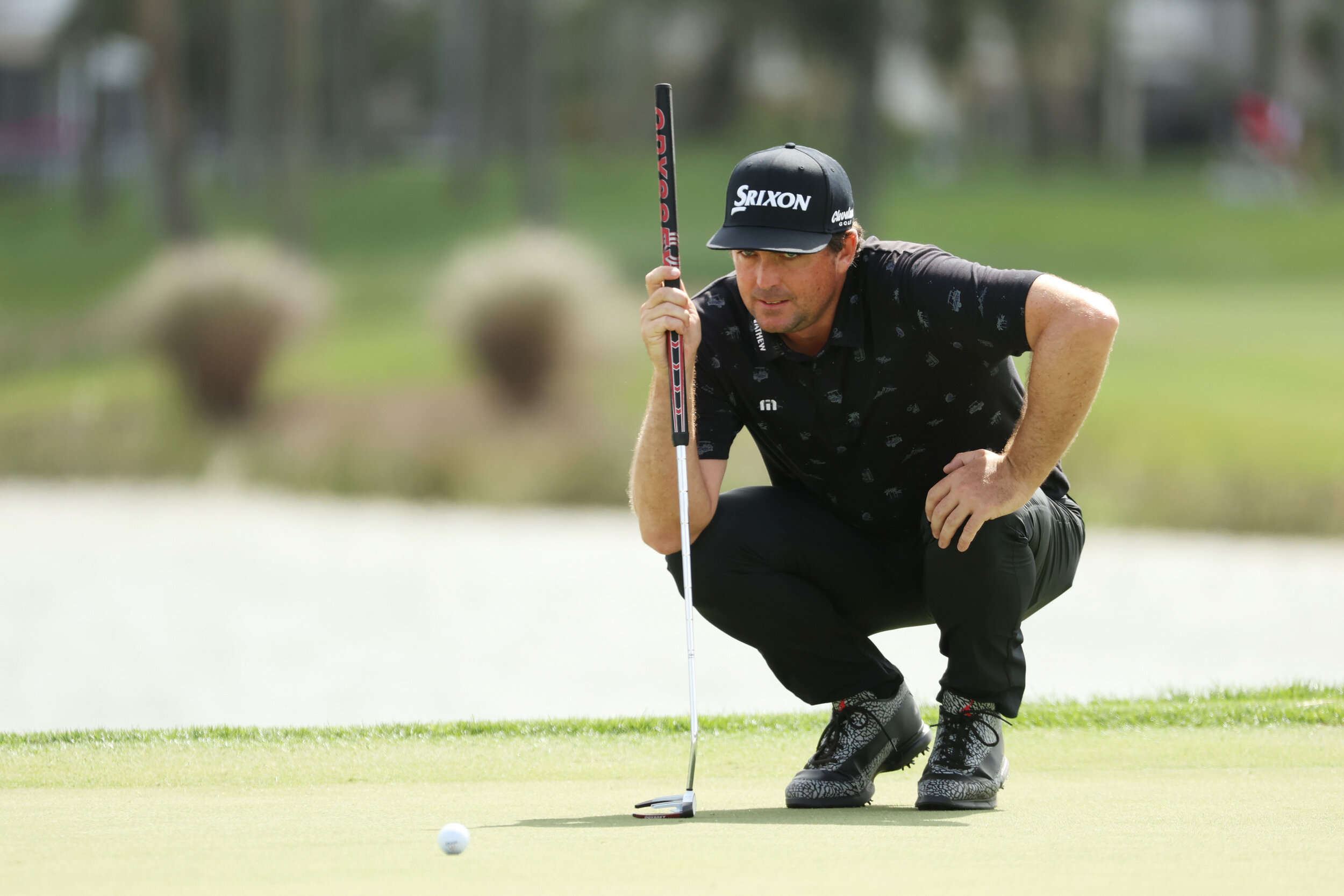  PALM BEACH GARDENS, FLORIDA - MARCH 20: Keegan Bradley of the United States lines up a putt on the 18th green during the third round of The Honda Classic at PGA National Champion course on March 20, 2021 in Palm Beach Gardens, Florida. (Photo by Cli