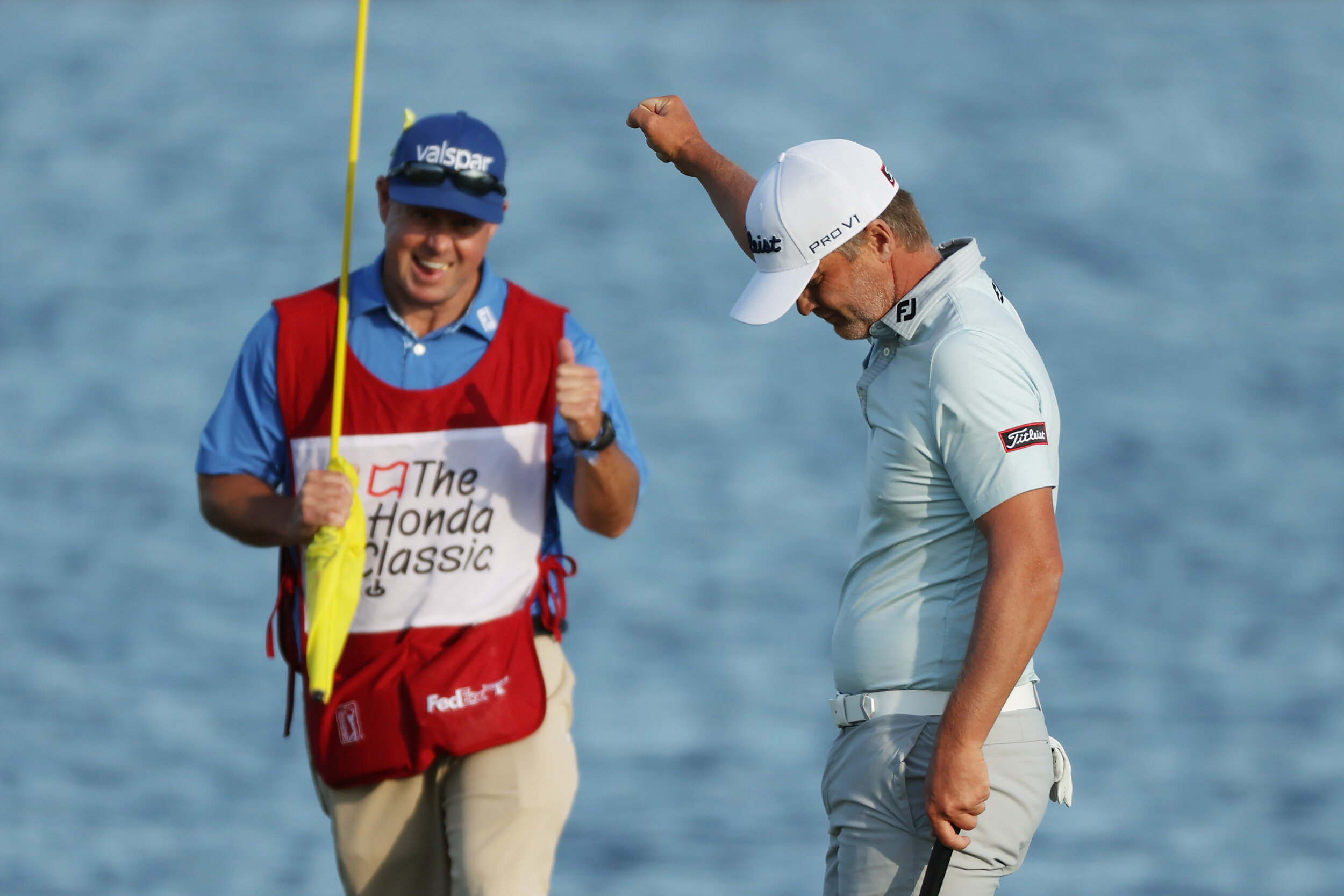  PALM BEACH GARDENS, FLORIDA - MARCH 21: Matt Jones of Australia celebrates with caddie Lance Bailey after winning on the 18th green during the final round of The Honda Classic at PGA National Champion course on March 21, 2021 in Palm Beach Gardens, 