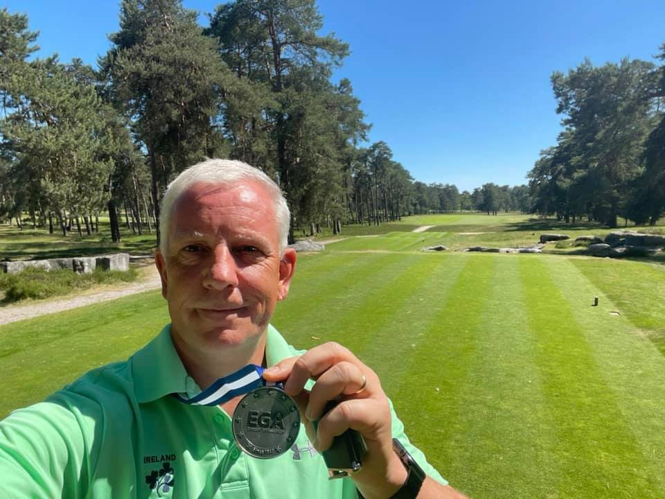 Karl Bornemann shows off his silver medal from the European Seniors Championship at Golf de Morfontaine in France.