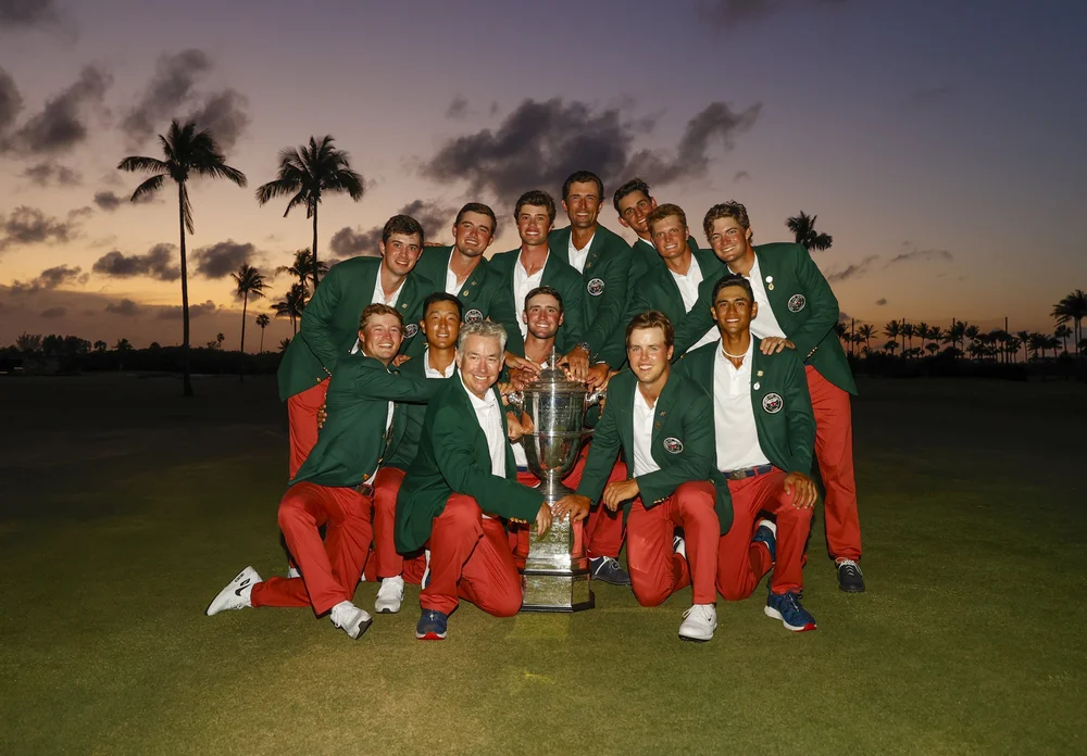 The USA Walker Cup Team poses with the trophy after defeating Great Britain & Ireland 14-12 at Seminole Golf Club in Juno Beach, Fla. on Sunday, May 9, 2021. (Chris Keane/USGA)