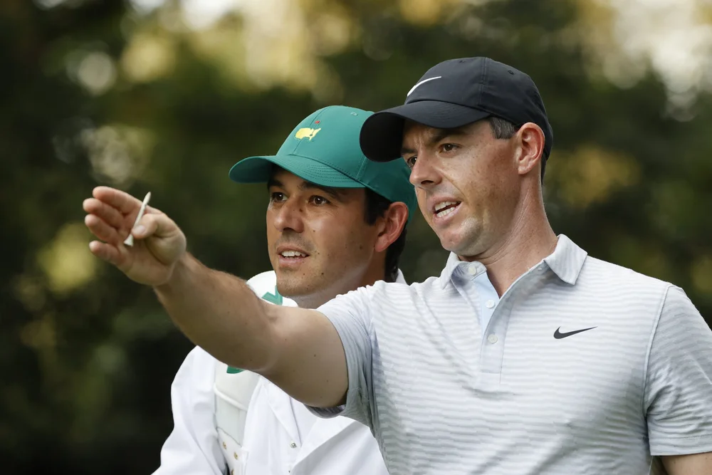 Rory McIlroy of Northern Ireland and caddie Harry Diamond walk off the No. 2 tee during Round 1 of the Masters at Augusta National Golf Club, Thursday, November 12, 2020.