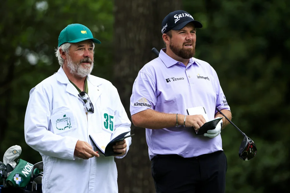 hane Lowry of Ireland and caddie Brian Martin on the No. 2 tee during Round 3 of the Masters at Augusta National Golf Club, Saturday, April 10, 2021.