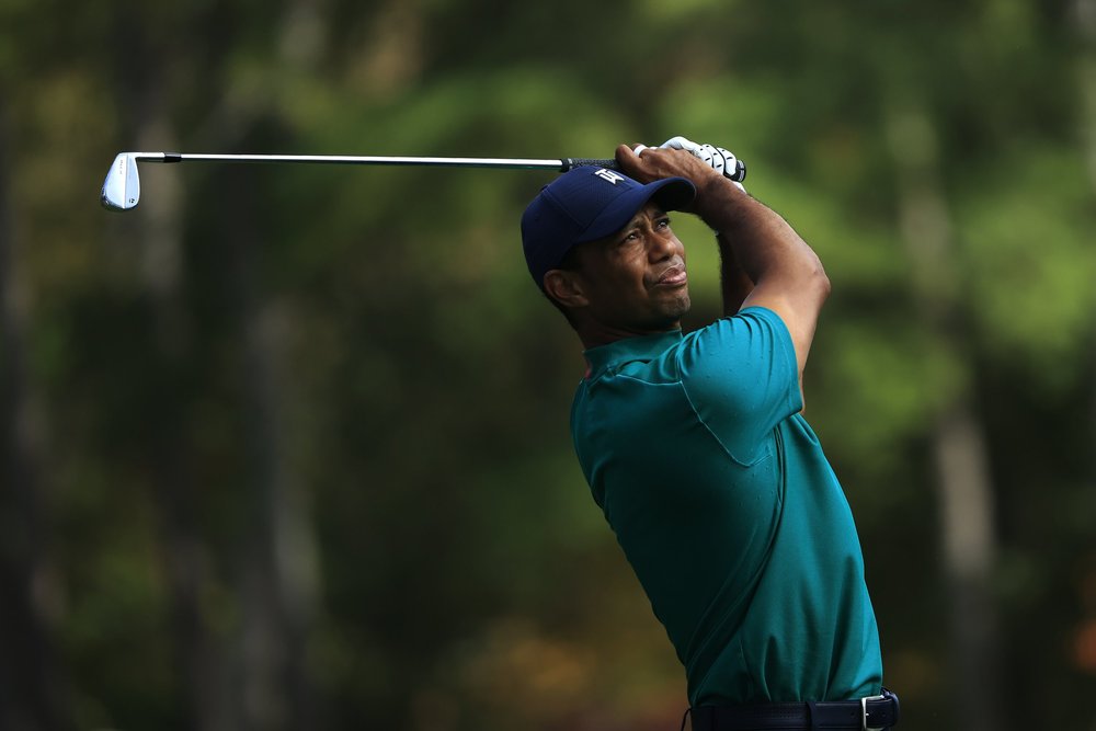 Masters champion Tiger Woods plays his stroke from the No. 12 tee during Practice Round 2 for the Masters at Augusta National Golf Club, Monday, November 9, 2020.