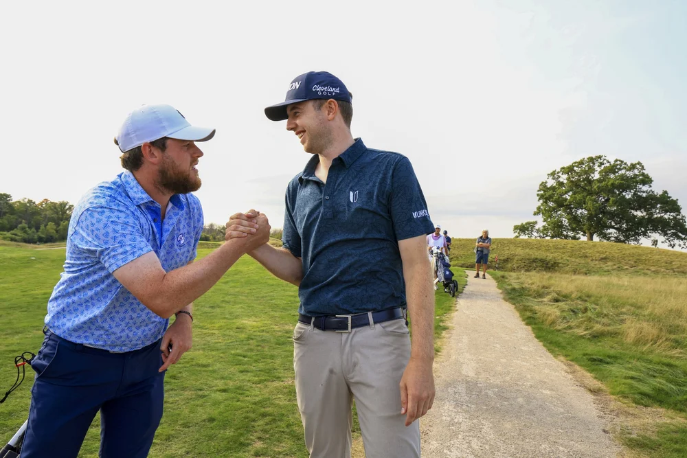 Fellow Irishmen Matthew McClean, left, and Hugh Foley celebrate winning their matches during the round of 32 at the 2022 U.S. Mid-Amateur at Erin Hills in Erin, Wis. on Wednesday, Sept. 14, 2022. (Steven Gibbons/USGA)