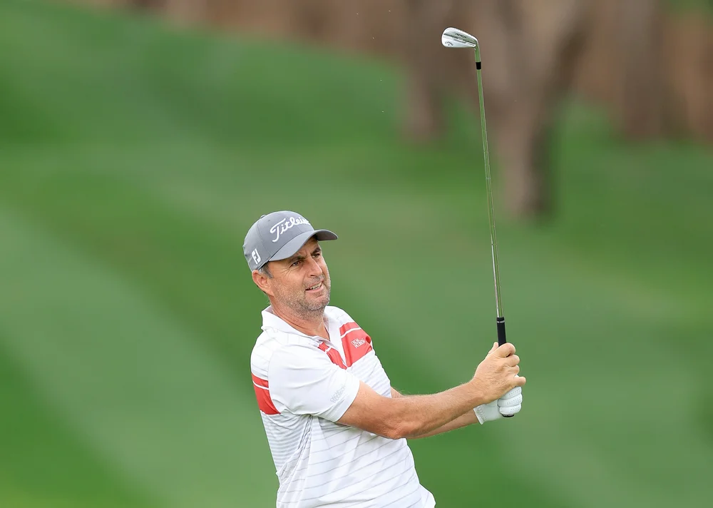 Richard Bland of England plays his second shot on the first hole during the completion of his first round on Day Two the Hero Dubai Desert Classic on the Majlis Course at The Emirates Golf Club on January 27, 2023 in Dubai, United Arab Emirates. (Pho