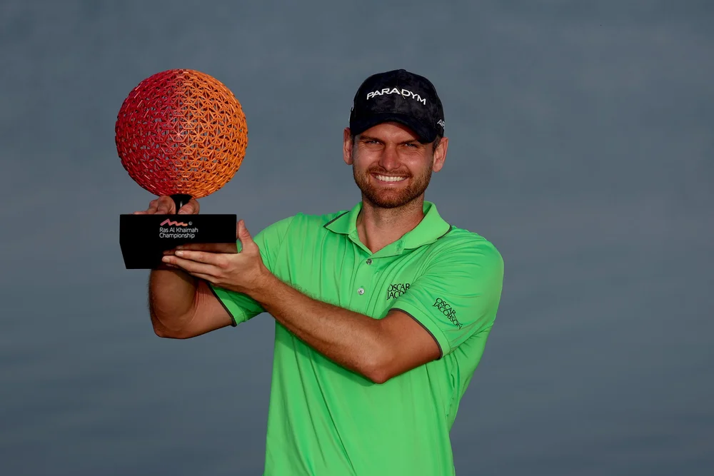 Daniel Gavins of England poses with the Ras Al Khaimah Championship trophy. Photo by Warren Little/Getty Images