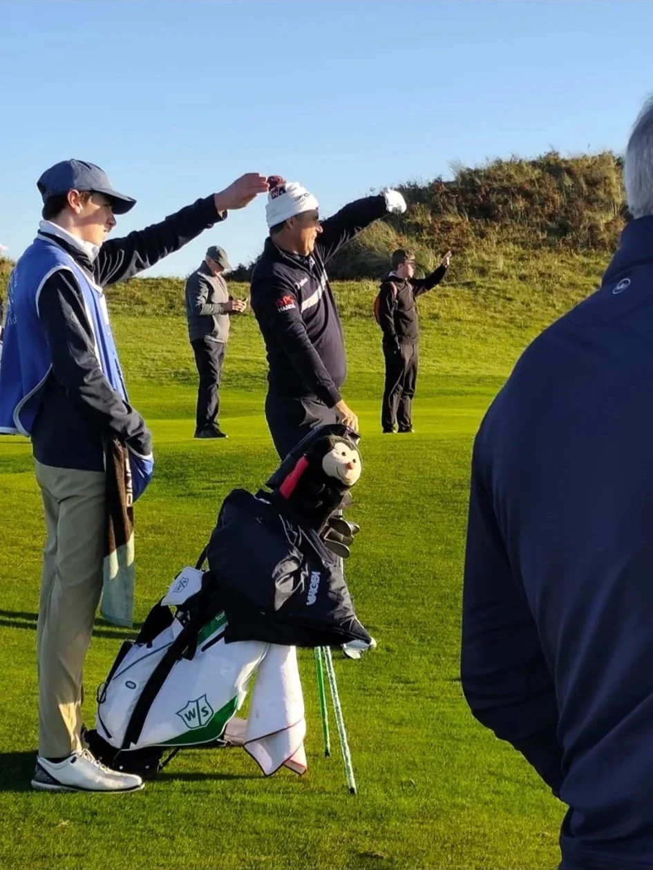 Pádraig Harrington shields his eyes from the winter sun at The Island