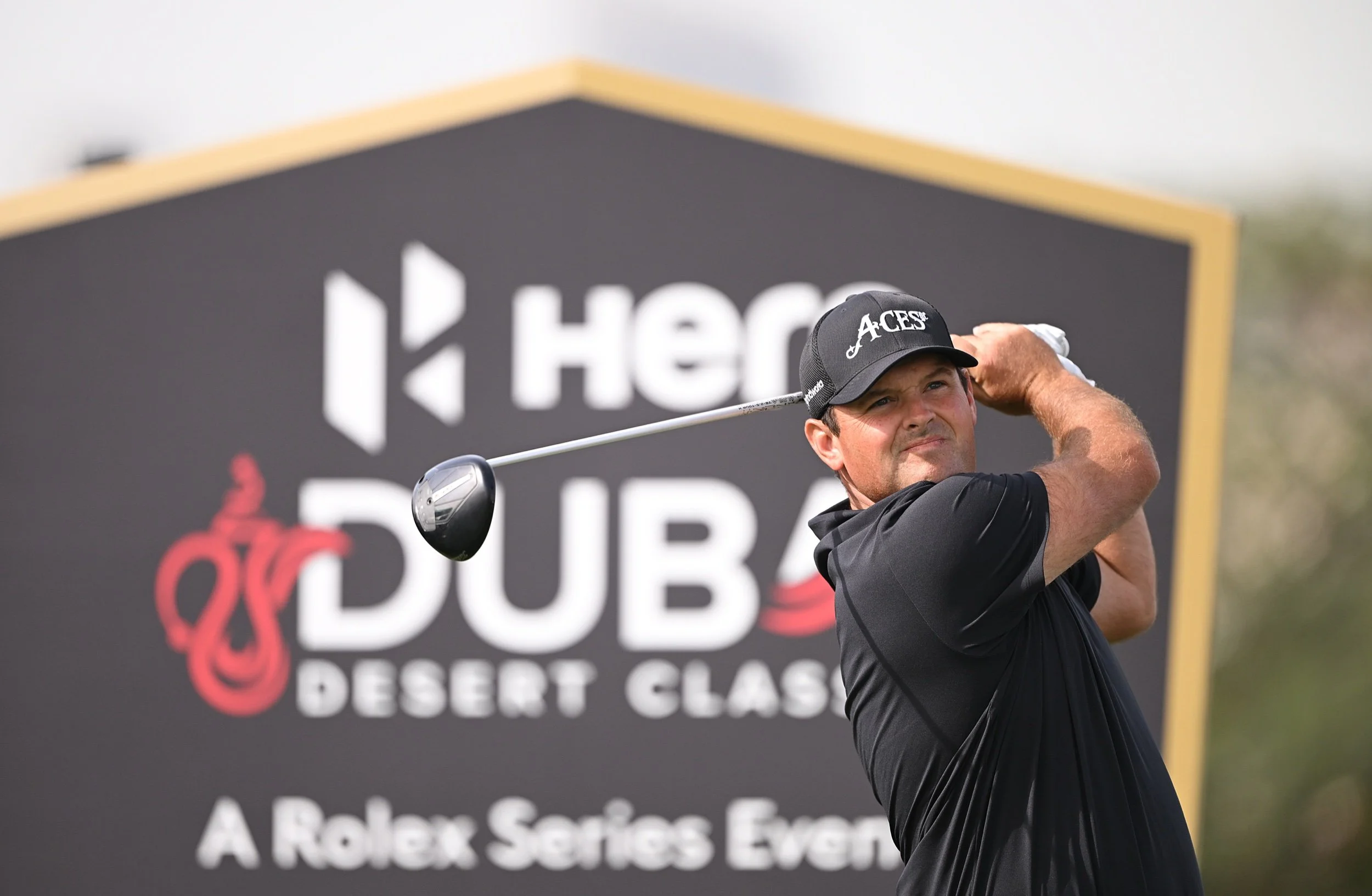 McIlroy targets weekend charge as Reed takes command in Dubai
