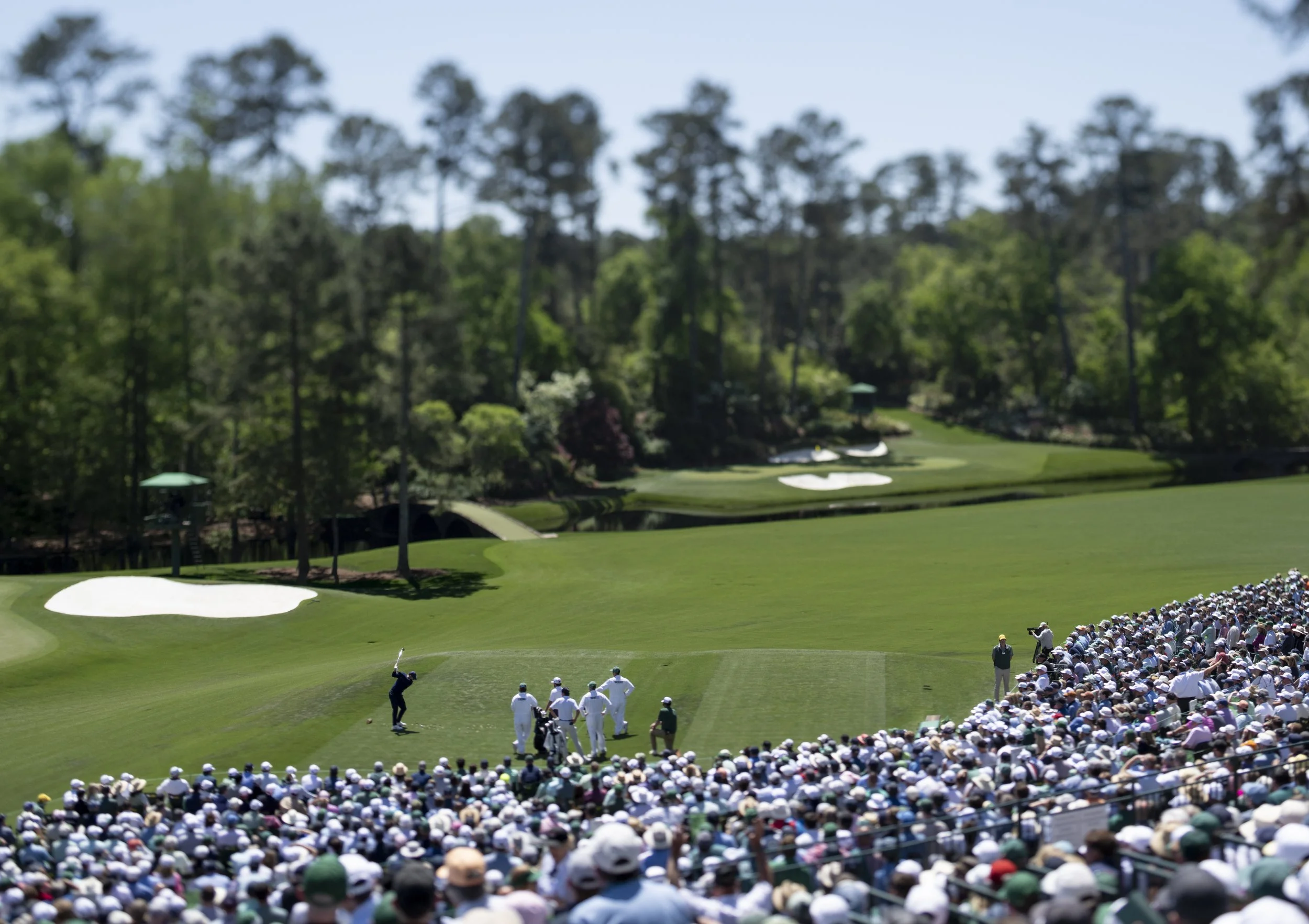 Masters champion Rory McIlroy of Northern Ireland plays a stroke from the No. 12 tee during the first round of the Masters at Augusta National Golf Club, Thursday, April 09, 2026.