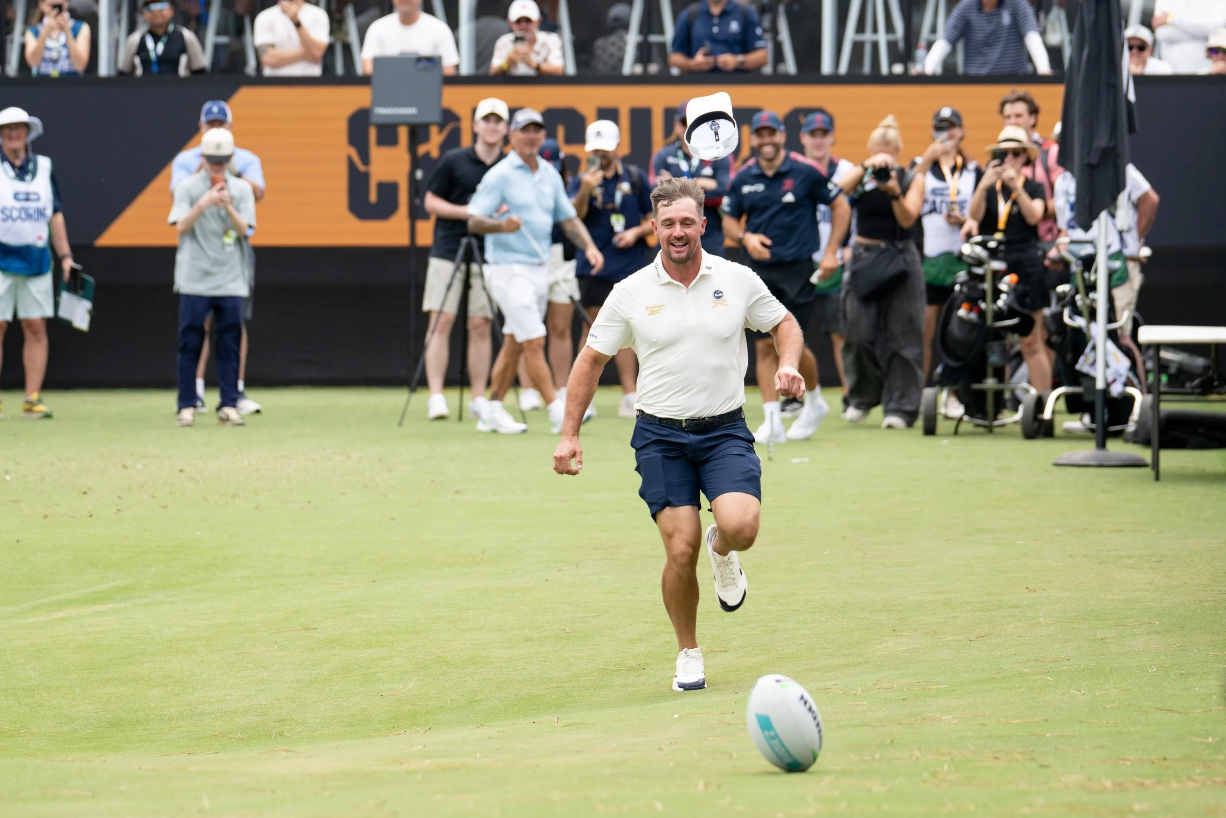Captain Bryson DeChambeau of Crushers GC chases a football on the 12th tee during the pro-am before the start of the LIV Golf Adelaide at Grange Golf Club on Wednesday, February 11, 2026 in Adelaide, Australia. (Photo by Matthew Harris/LIV Golf)