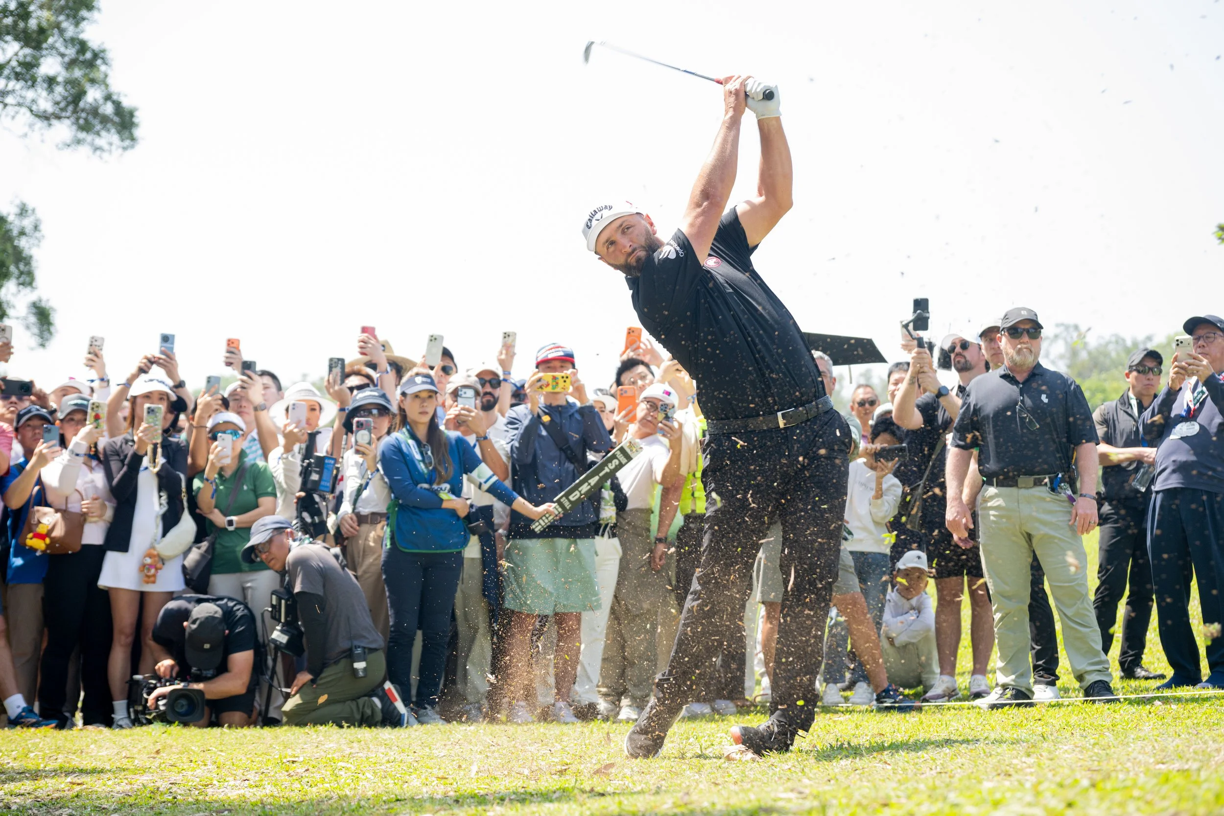 Jon Rahm hits his shot on the third hole during the final round of HSBC LIV Golf Hong Kong. Photo by Charles Laberge/LIV Golf
