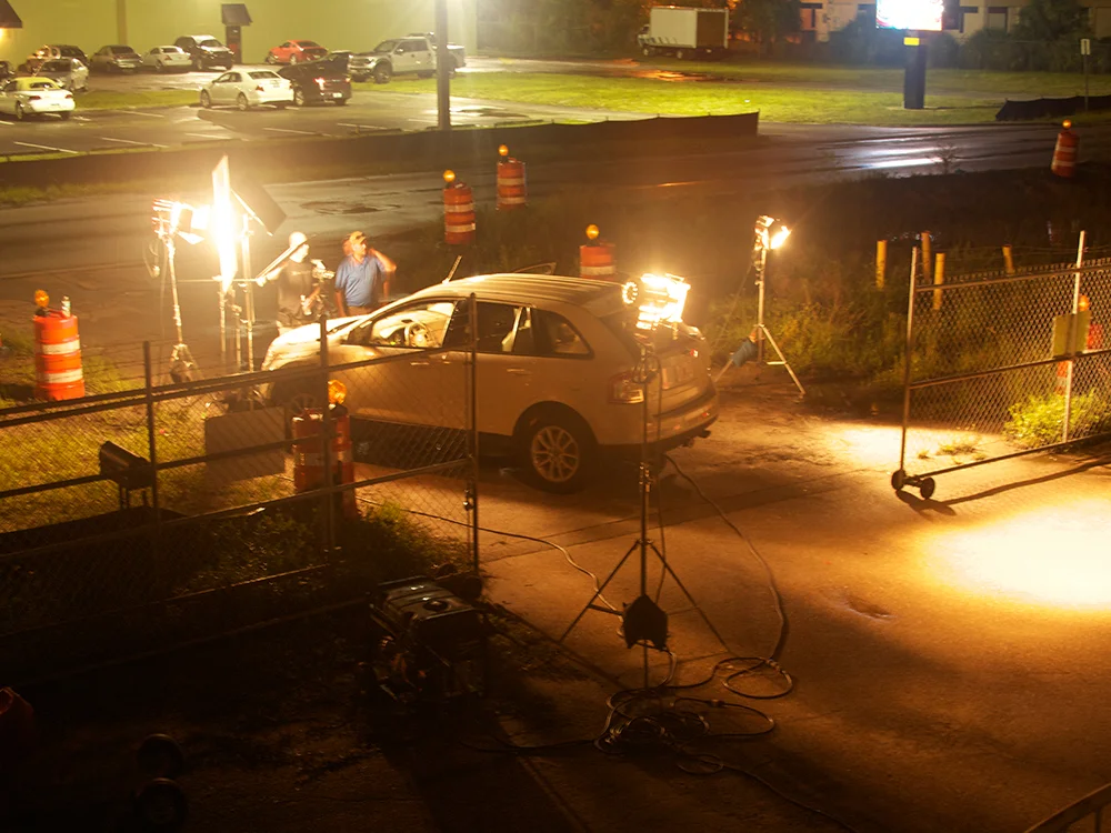 On location, lighting a stand-in vehicle for for the B&W "Ash Angel" series.