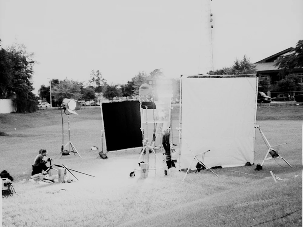 Exterior model photography, using two 12,000 watt lamps, one 24,000 watt lamp, and 12'x12' & 10'x10' negative fill sources.