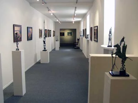 Part of the Gallery most damaged by fire is beautifully remodeled, now featuring small bronzes by Terry Kreiter and Darrel Phelps, along with paintings and prints by Mark Bryan.