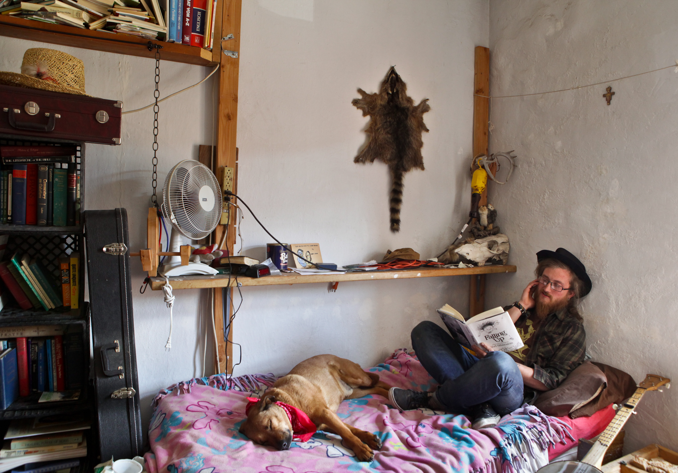  Marcus and Beer share this room at the Catholic Worker house in Denver, CO.&nbsp; The room is filled with books, remains of various dead animals, and musical instruments.&nbsp; On Tuesday nights Marcus gets together with friends to hand craft soap; 