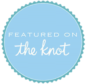 Blue circular badge with scalloped edges, featuring the text "FEATURED ON the knot" in white.